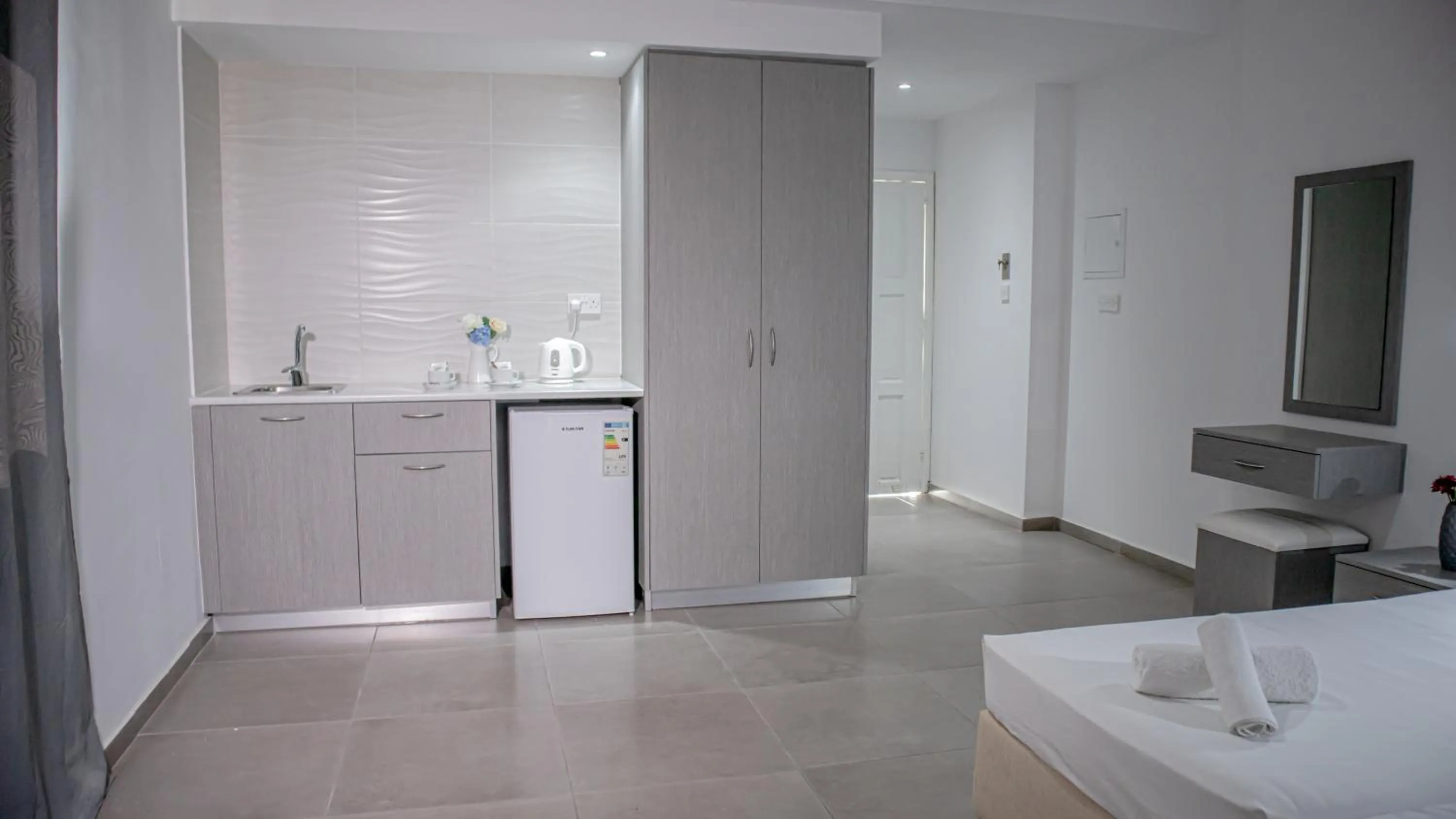 Kitchen or kitchenette in Windmills Hotel Apartments