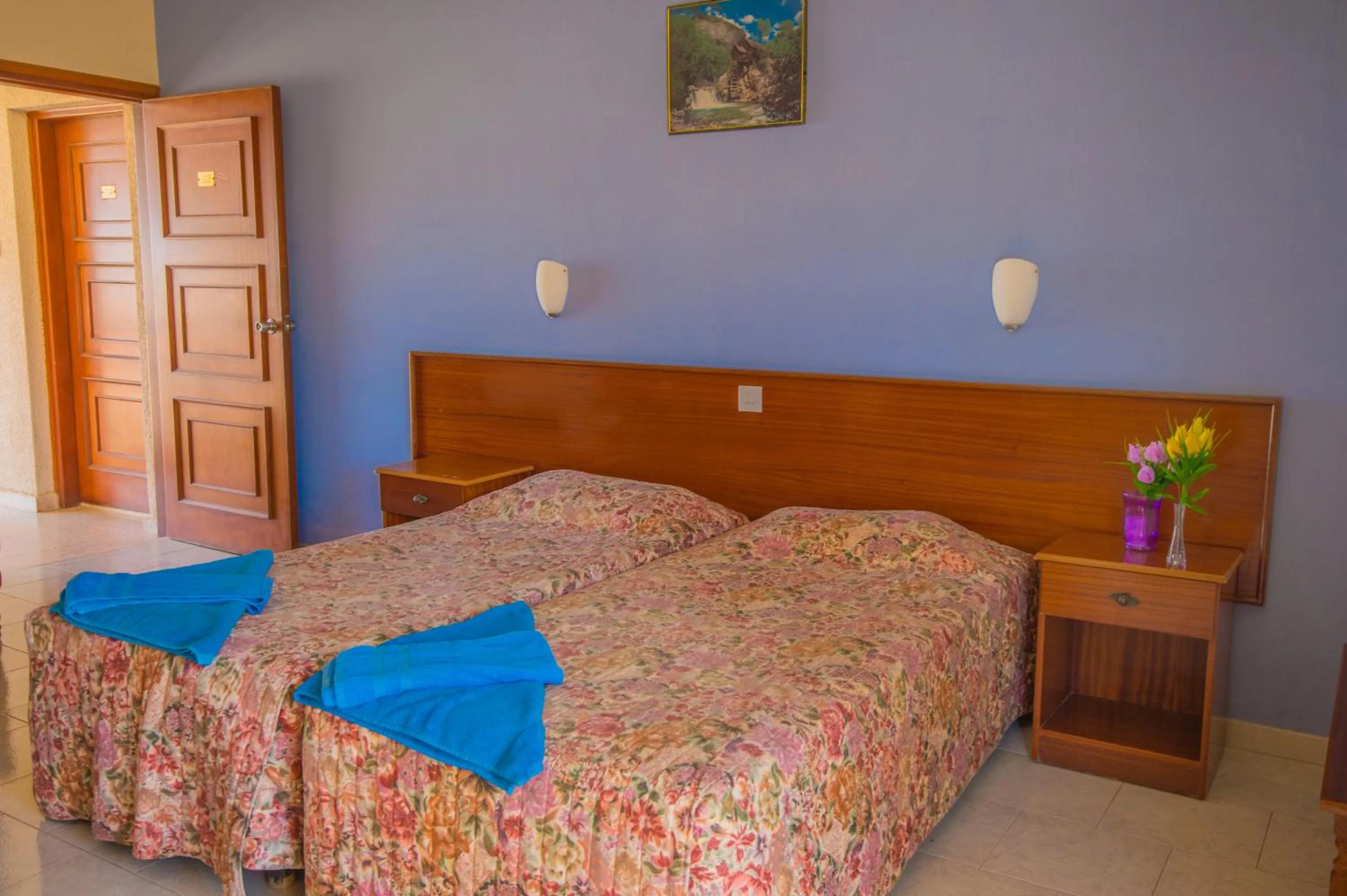 Bed in Windmills Hotel Apartments