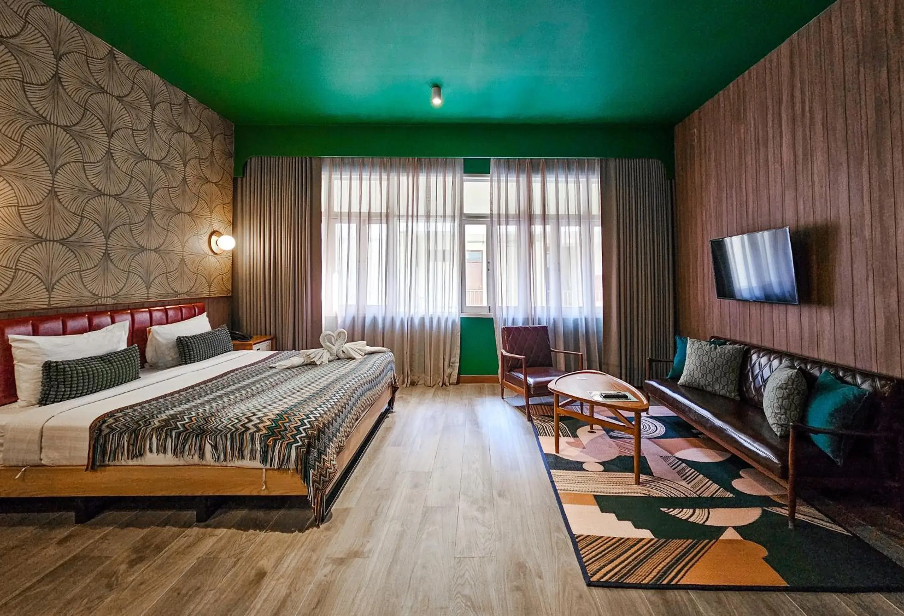 Communal lounge/ TV room, Bed in Miami Hotel Bangkok Communal lounge/ TV room, Bed in Miami Hotel Bangkok