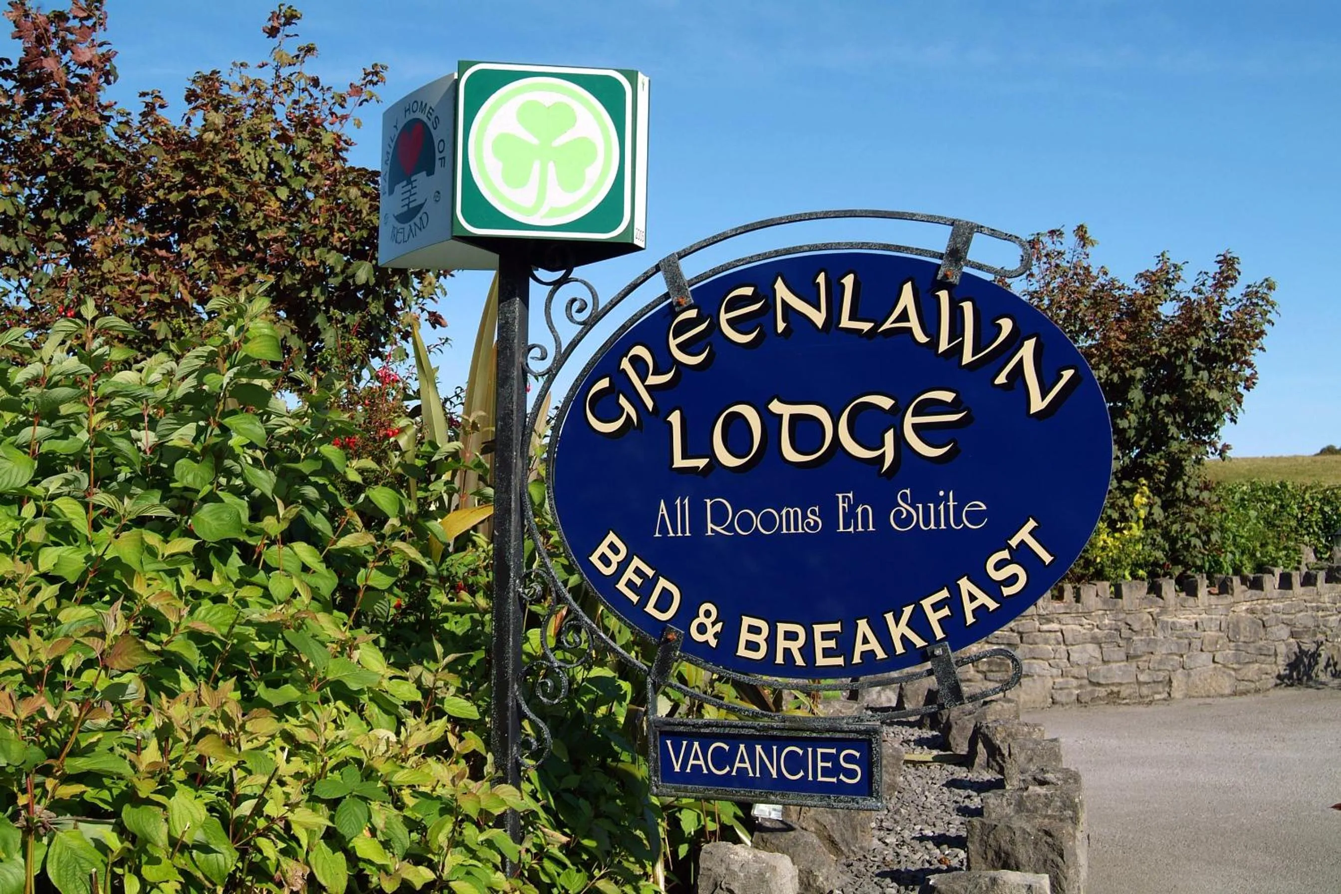 Property logo or sign in Greenlawn Lodge