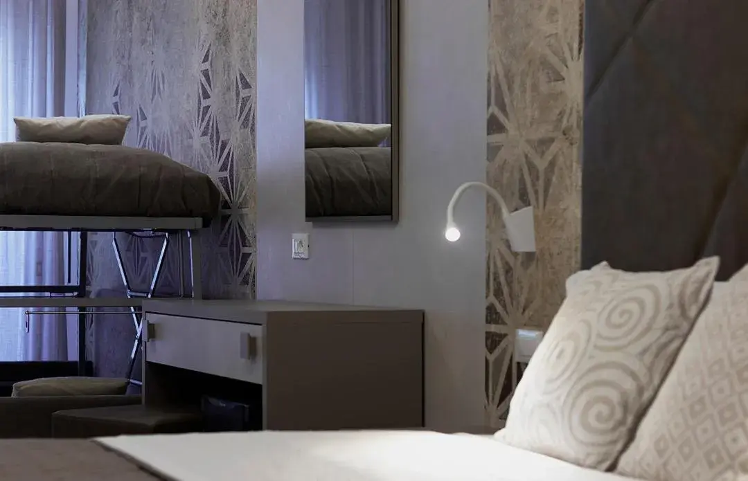 Quadruple Room with Balcony in Hotel All'Orologio Quadruple Room with Balcony in Hotel All'Orologio