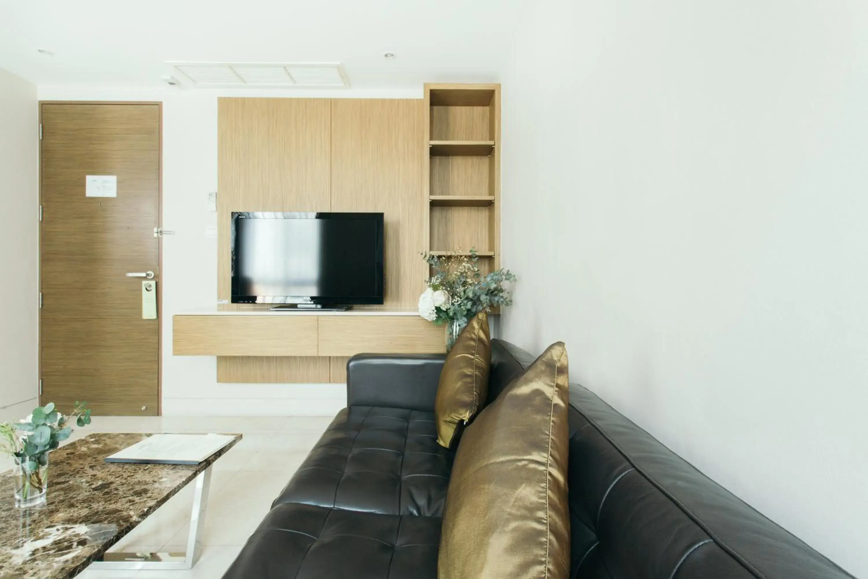 Living room in Thomson Residence Hotel Living room in Thomson Residence Hotel