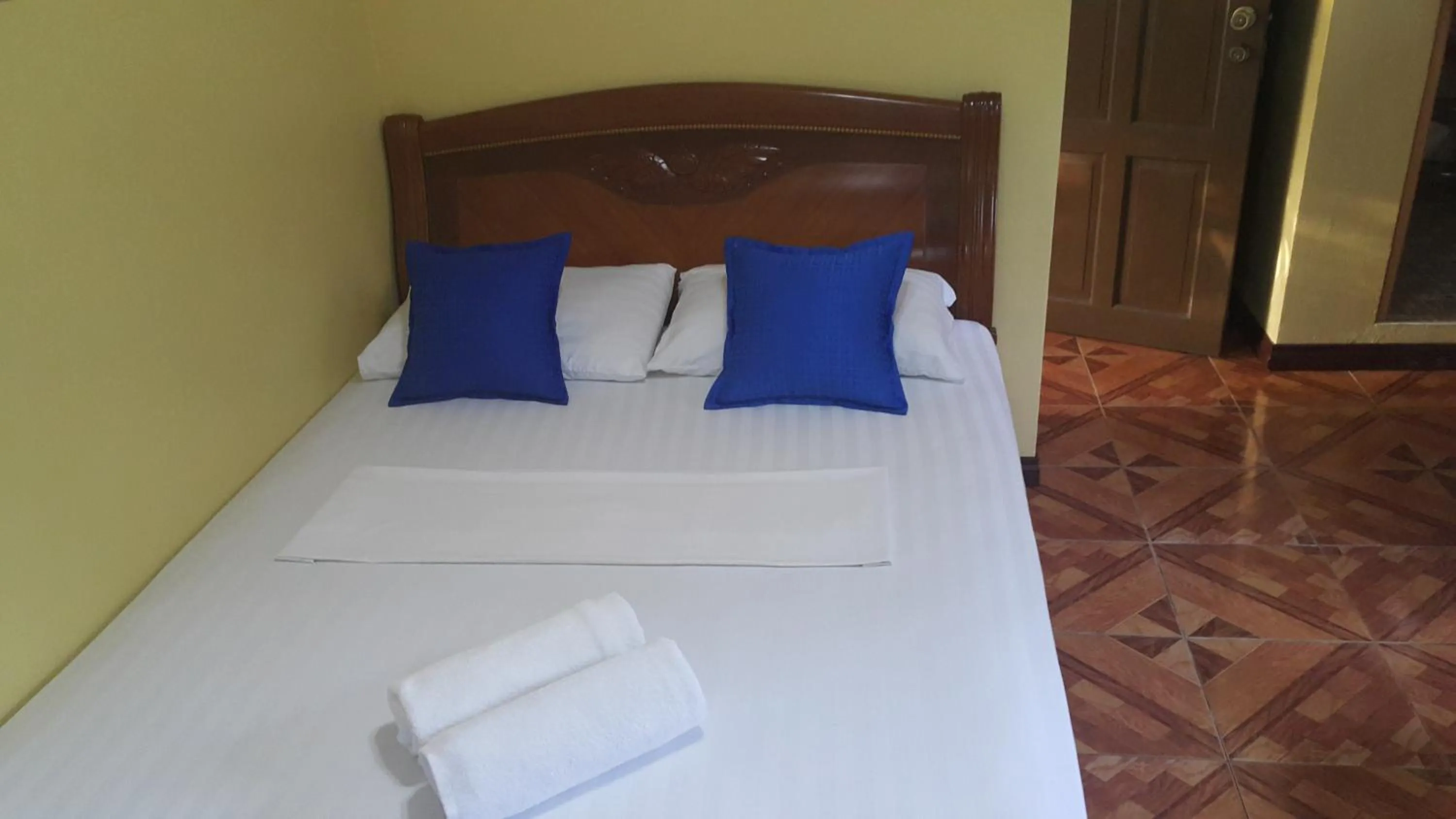 Bed in Carribean Transient House