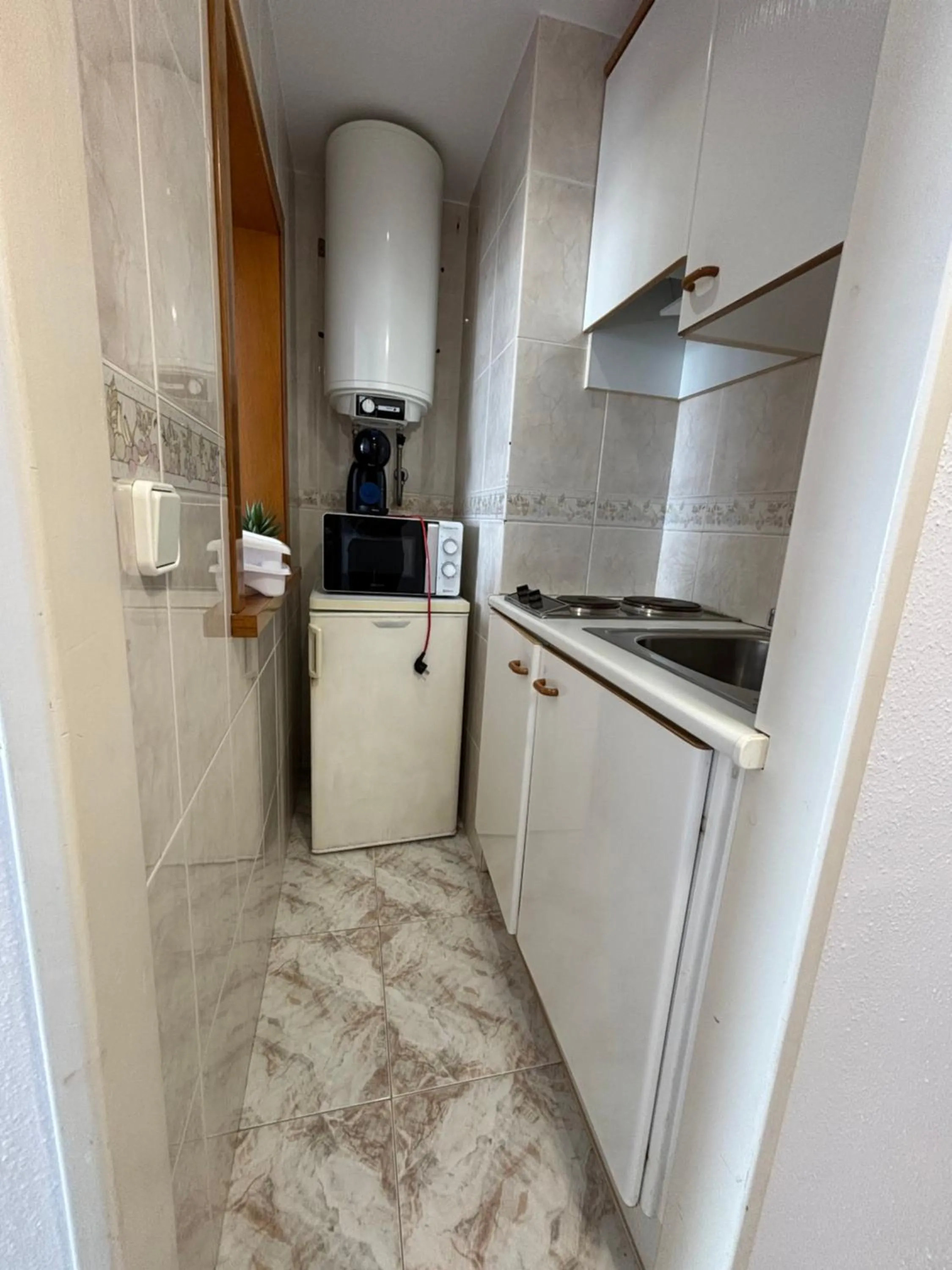 Kitchen or kitchenette in Hostal Santa Clara