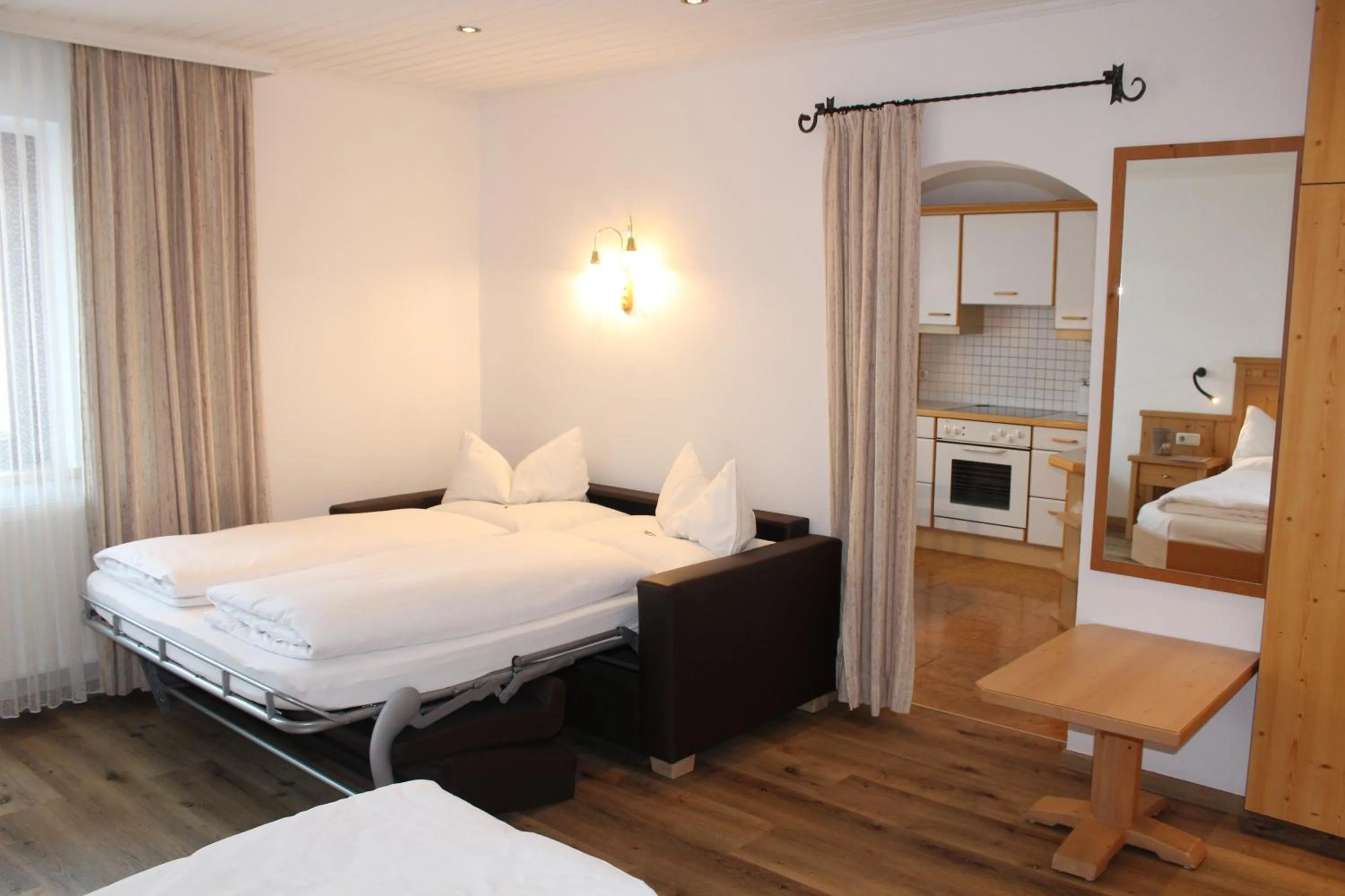 kitchen, Bed in Pension Norika