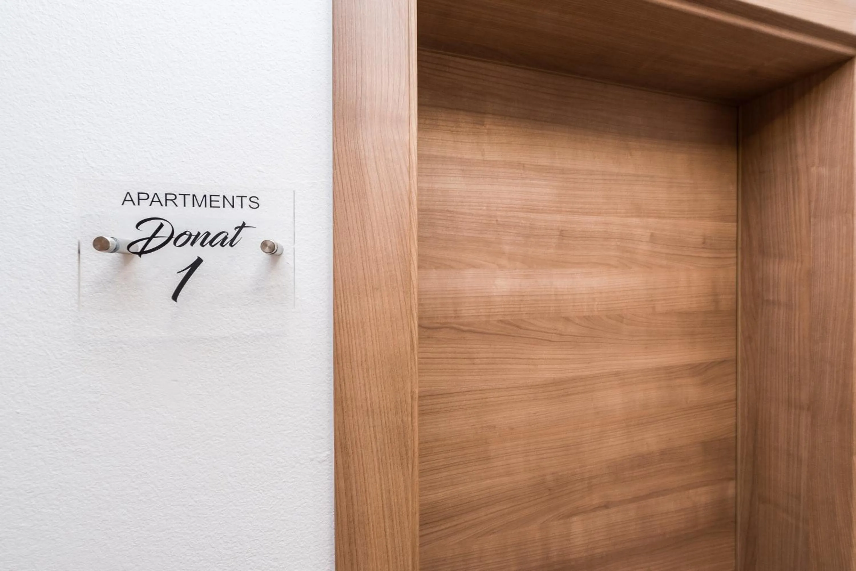 Property logo or sign in Apartments Donat