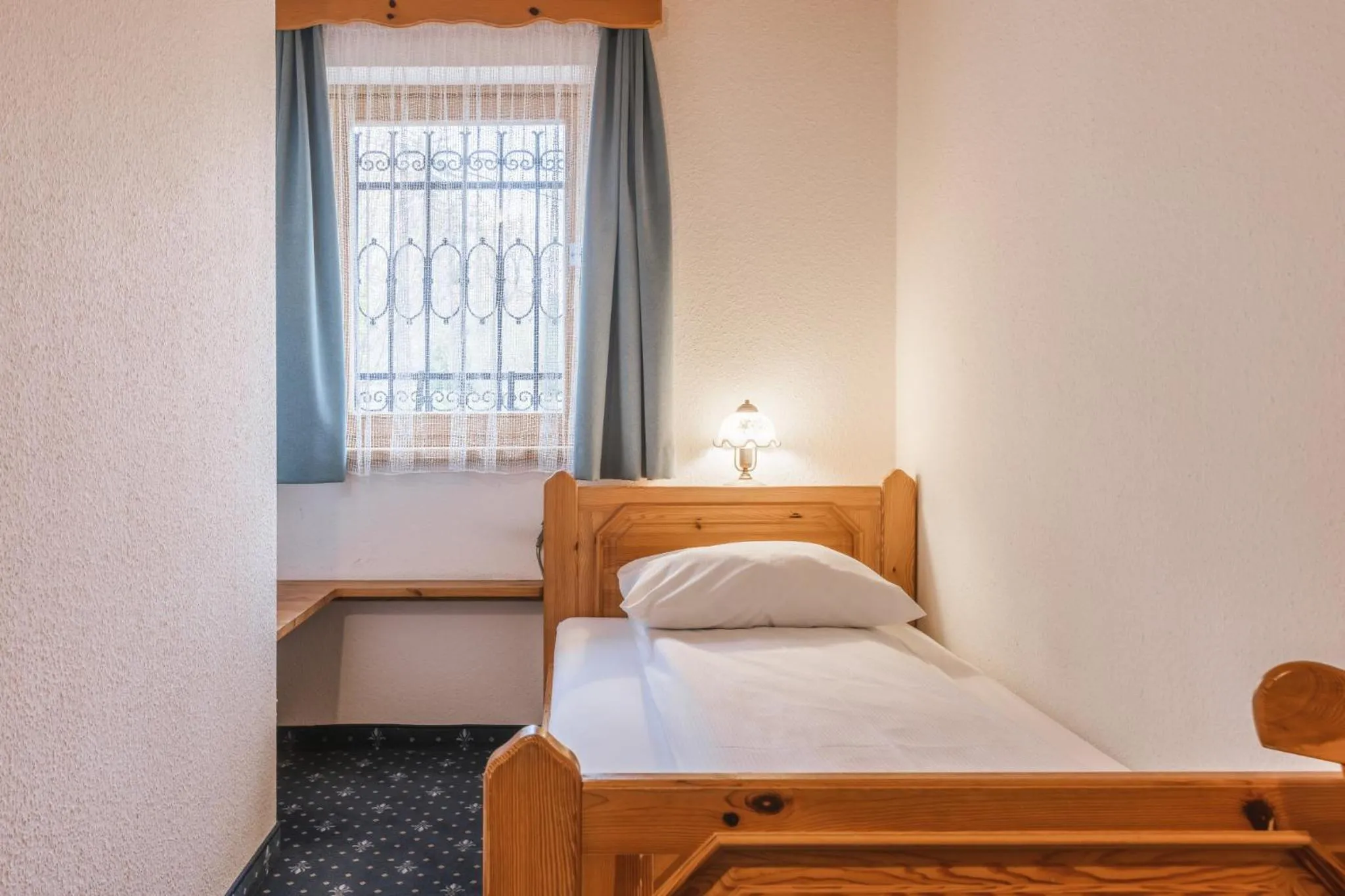 Bed in Garni Hotel Berc