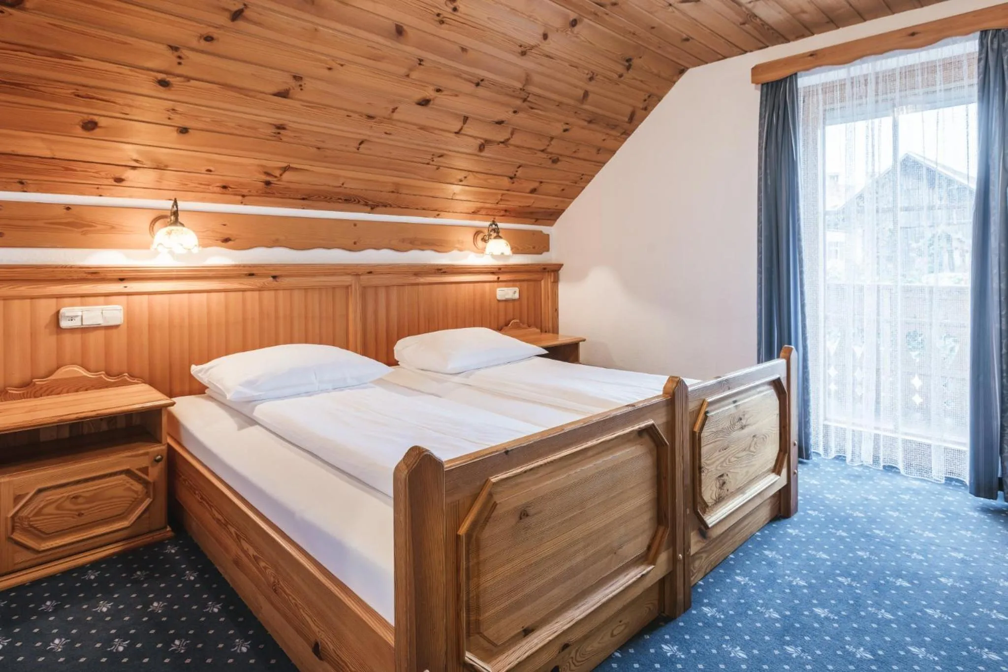 Bed in Garni Hotel Berc