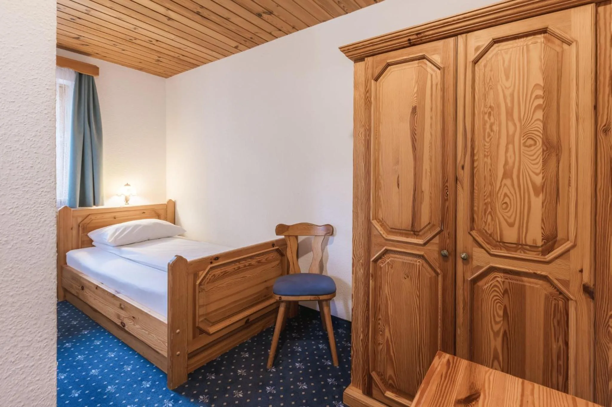 Bed in Garni Hotel Berc