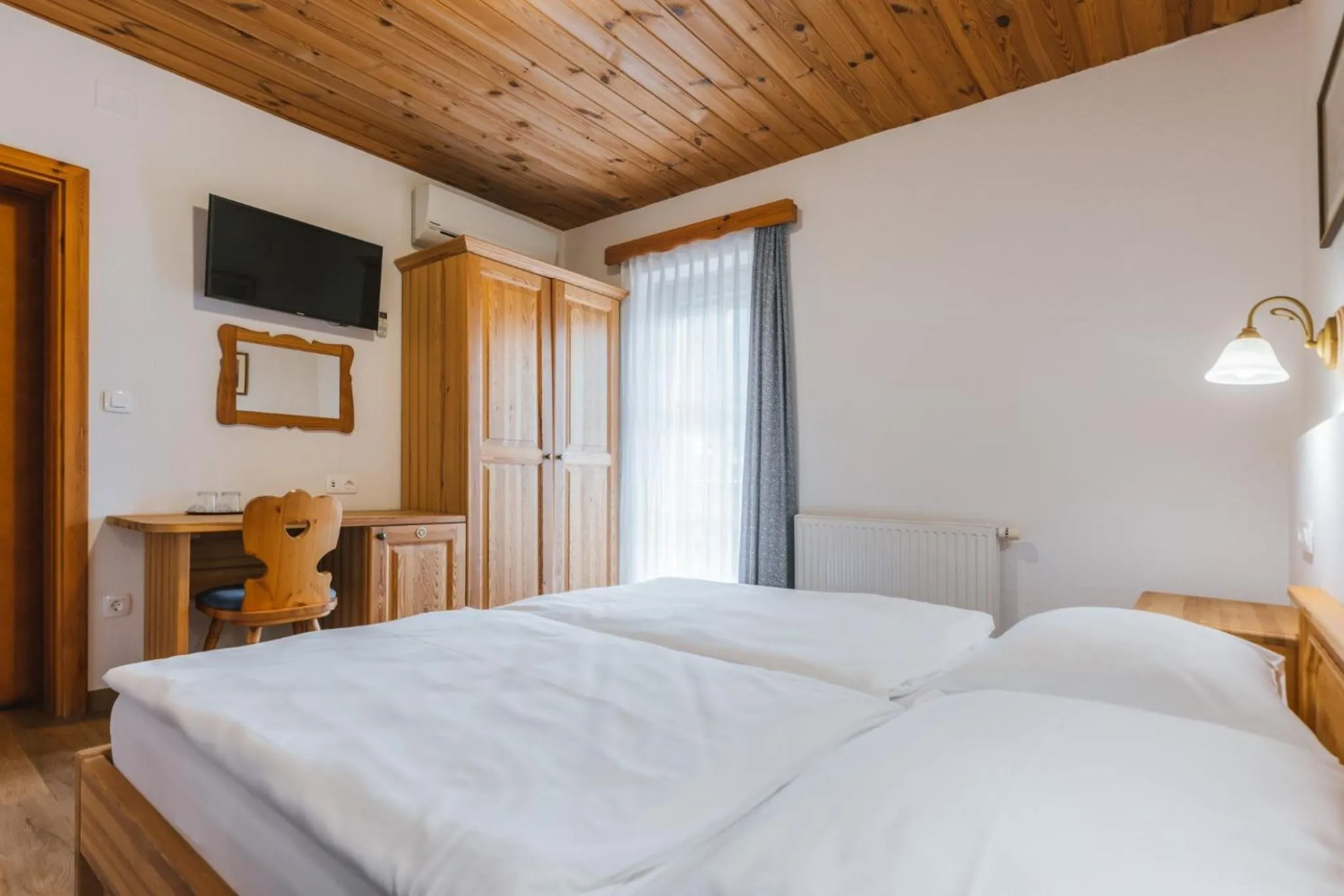 Bed in Garni Hotel Berc