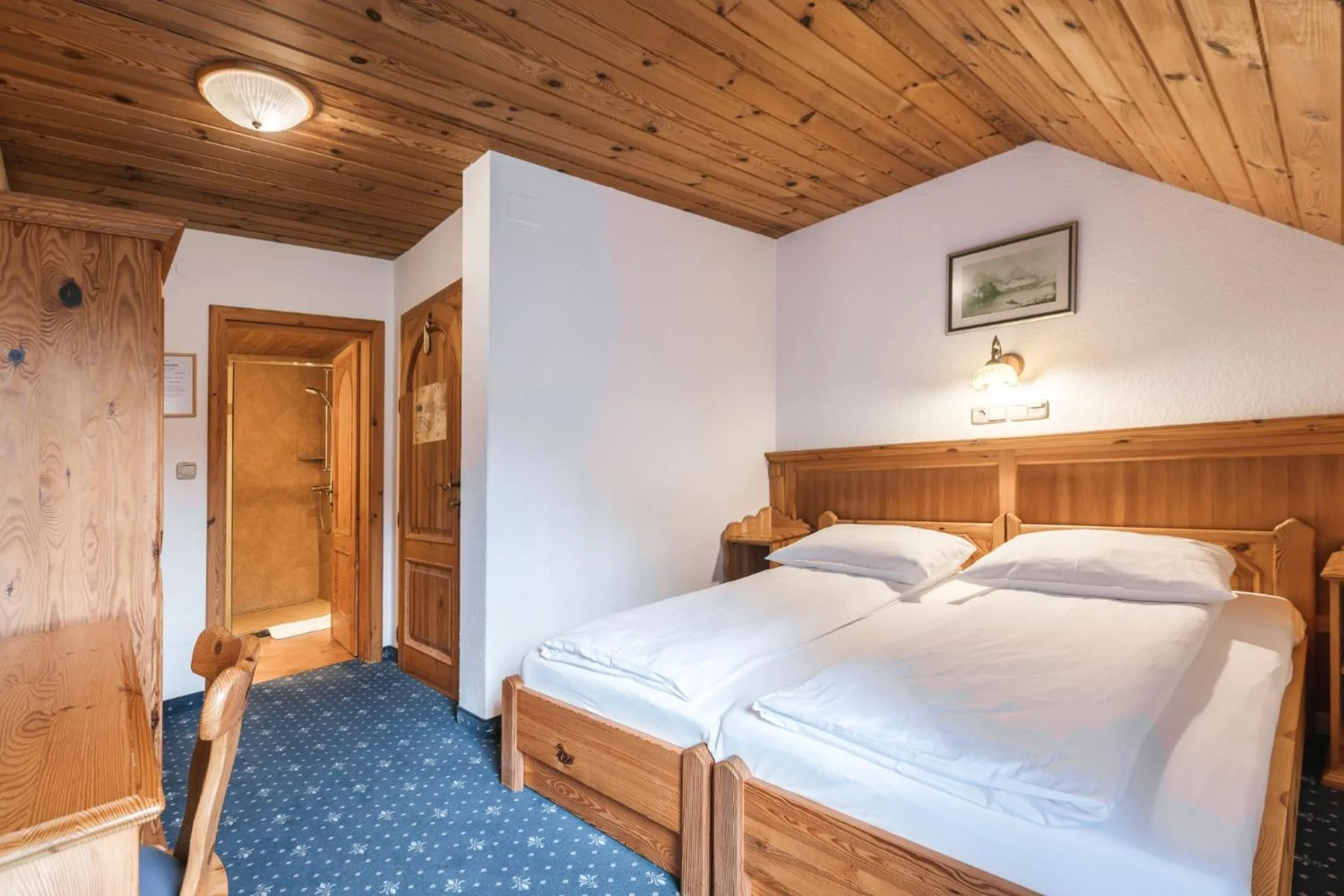 Bed in Garni Hotel Berc