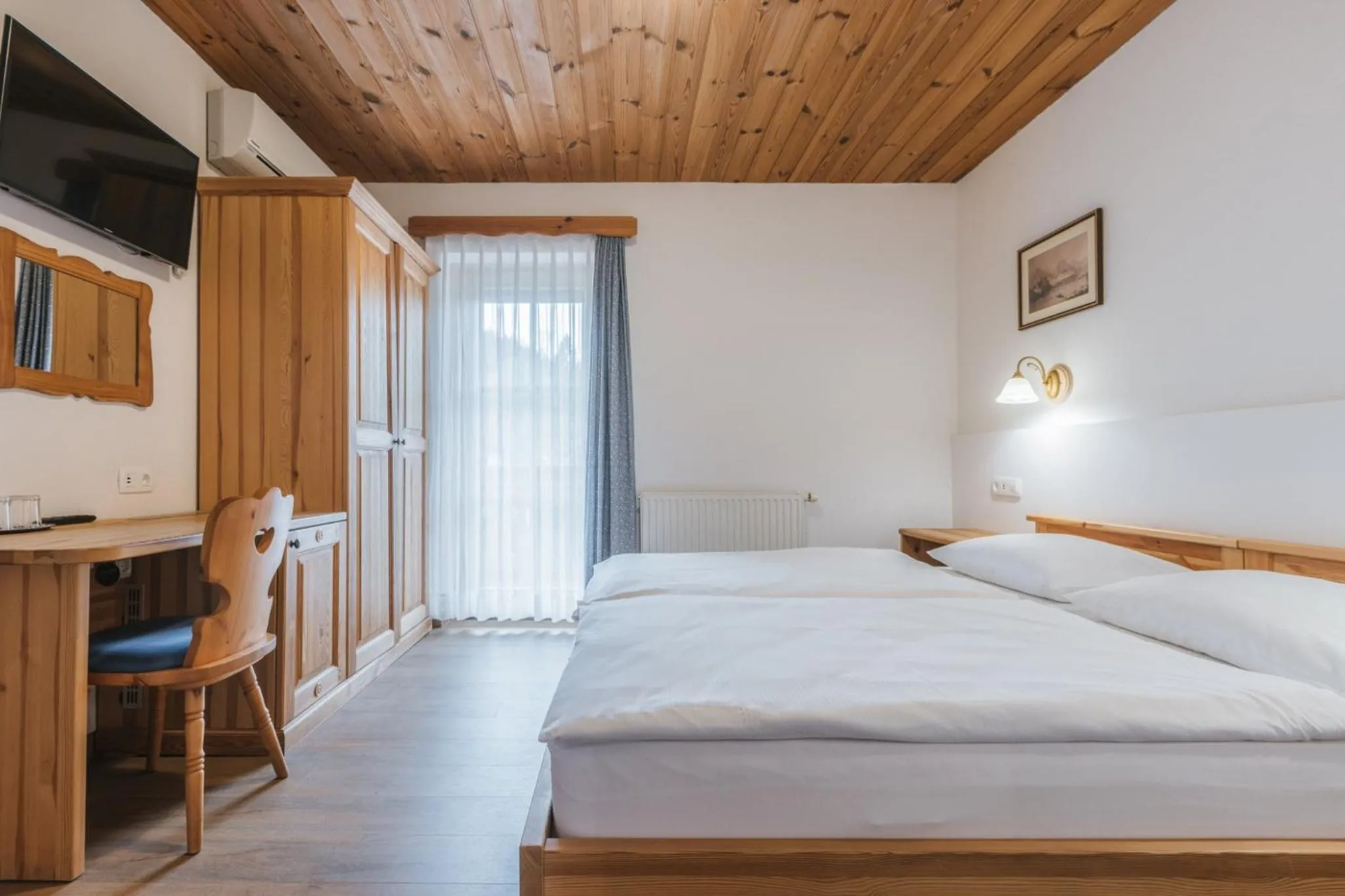 Bed in Garni Hotel Berc
