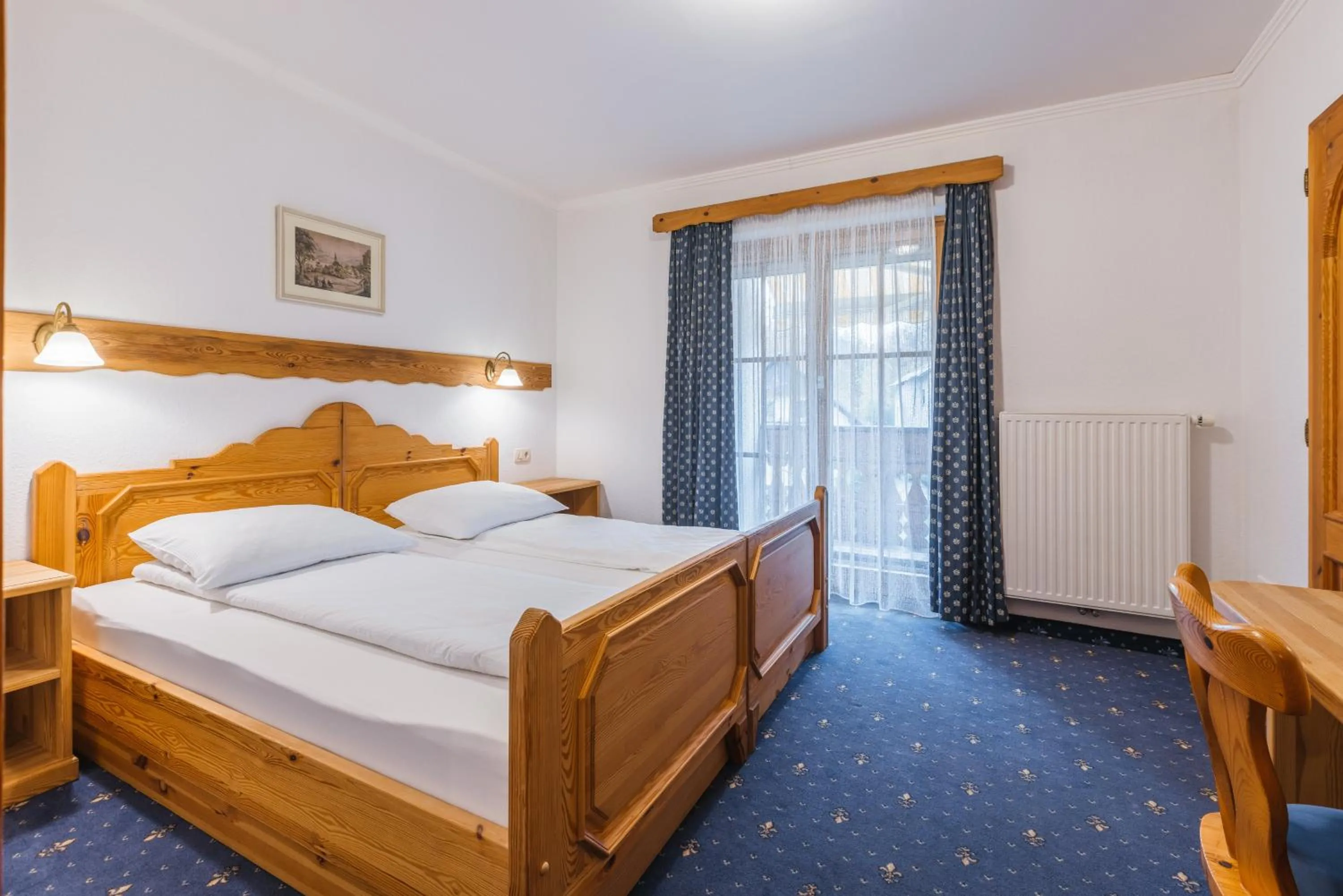 Bed in Garni Hotel Berc