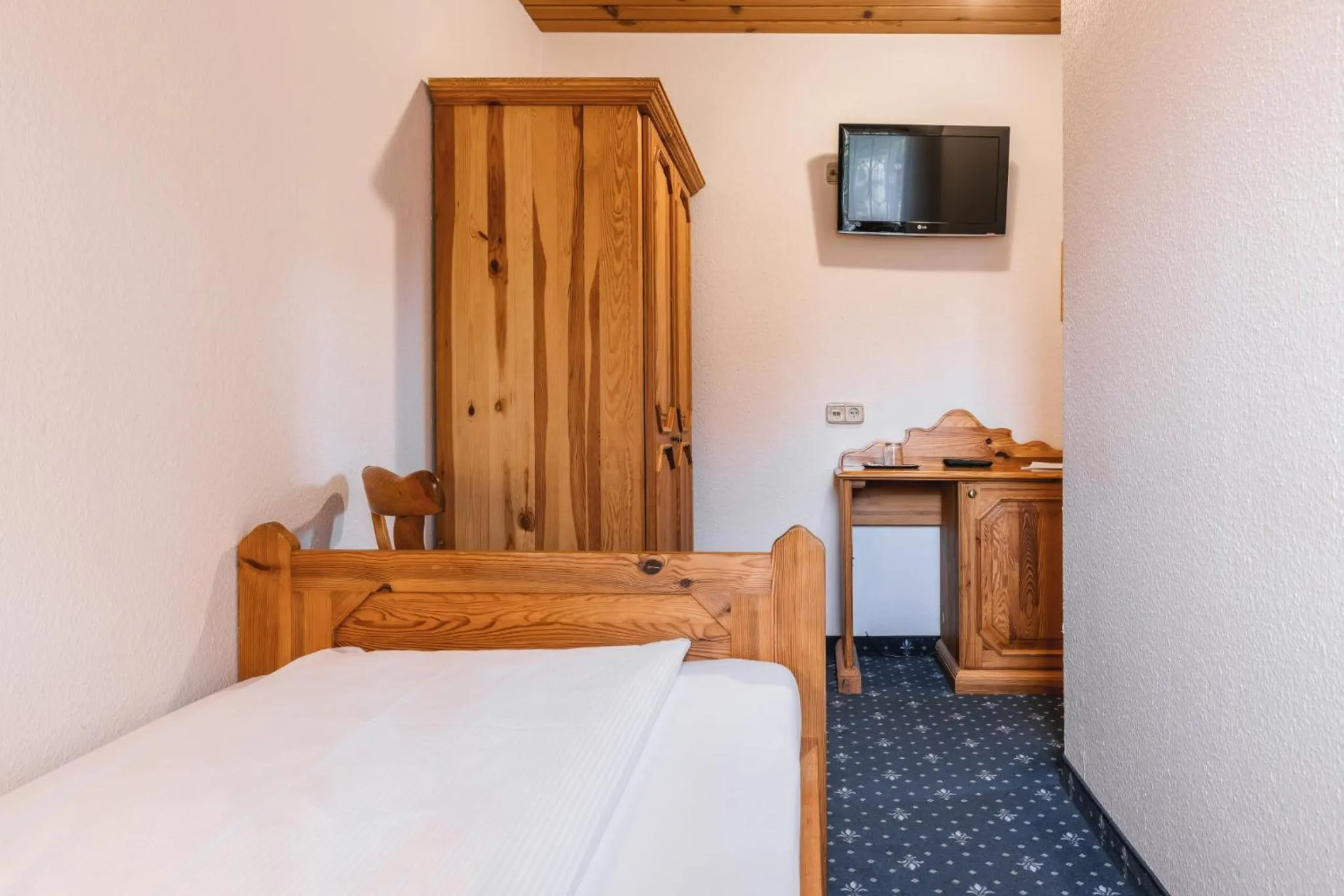Bed in Garni Hotel Berc