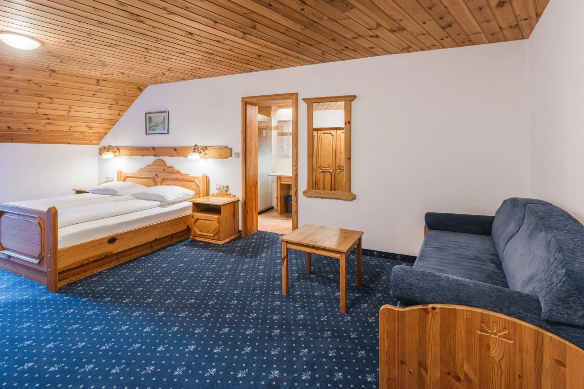 Bed in Garni Hotel Berc