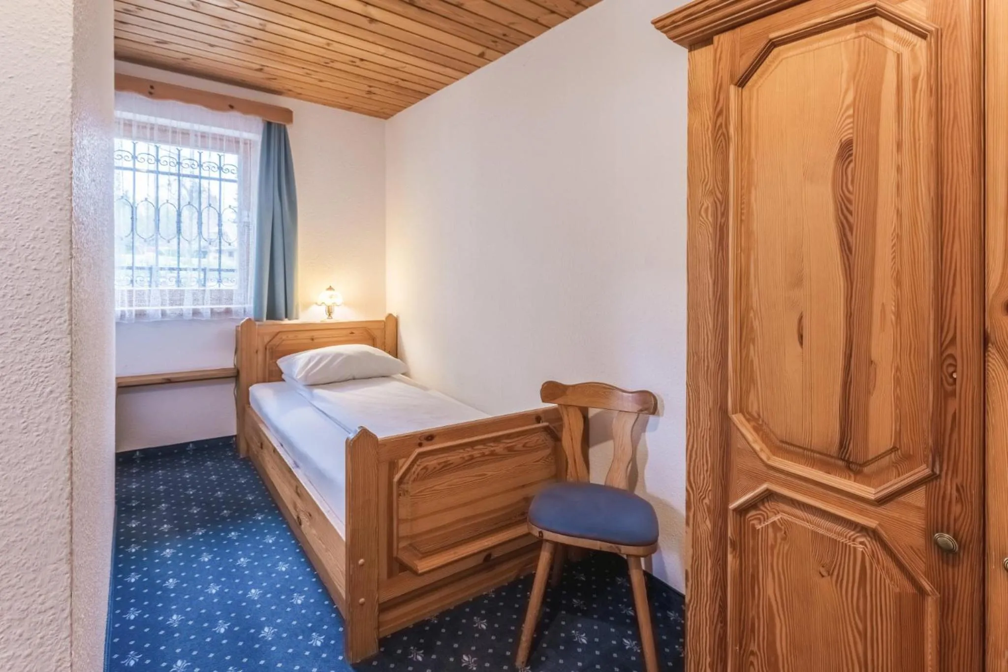 Bed in Garni Hotel Berc