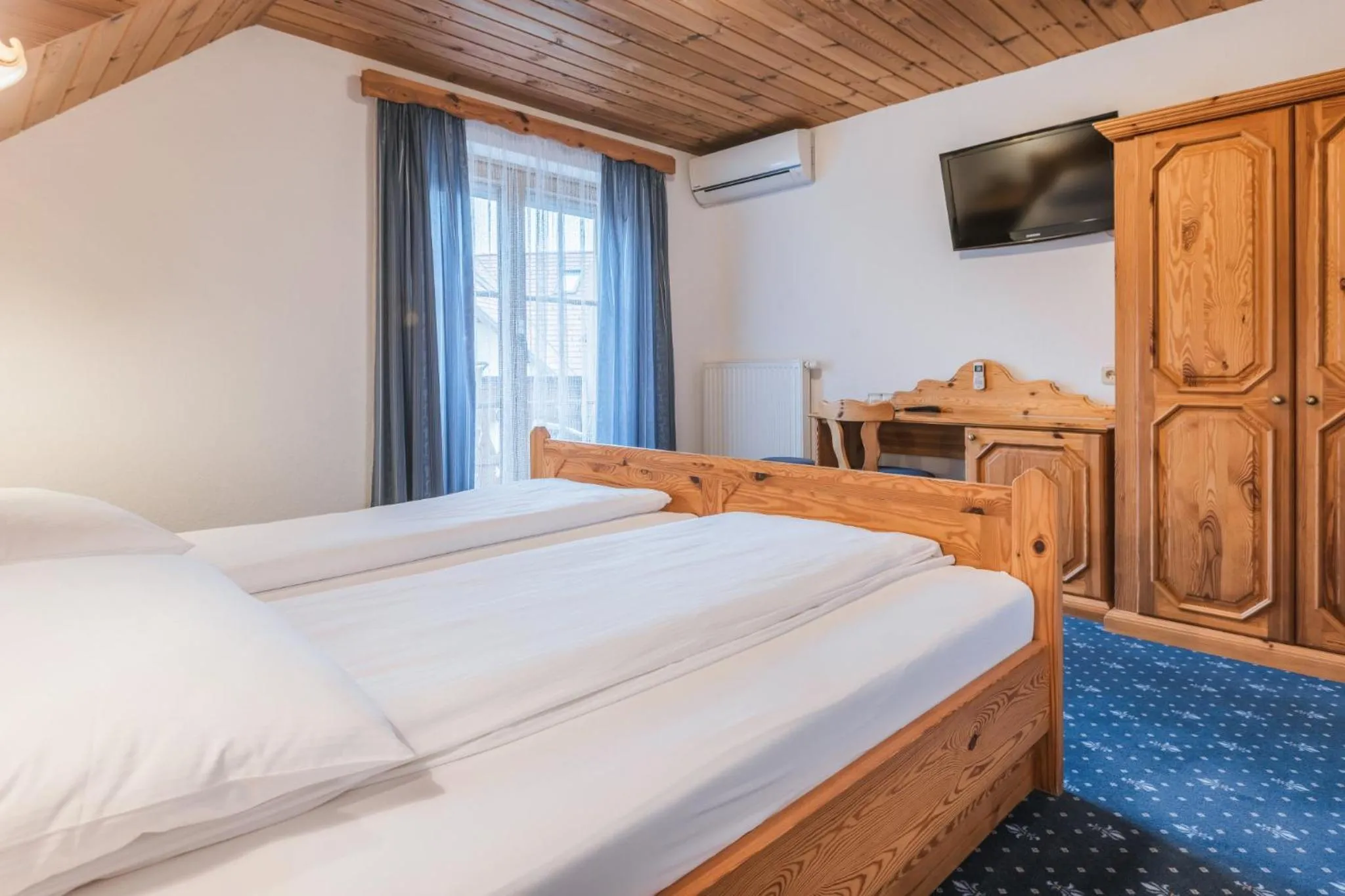 Bed in Garni Hotel Berc