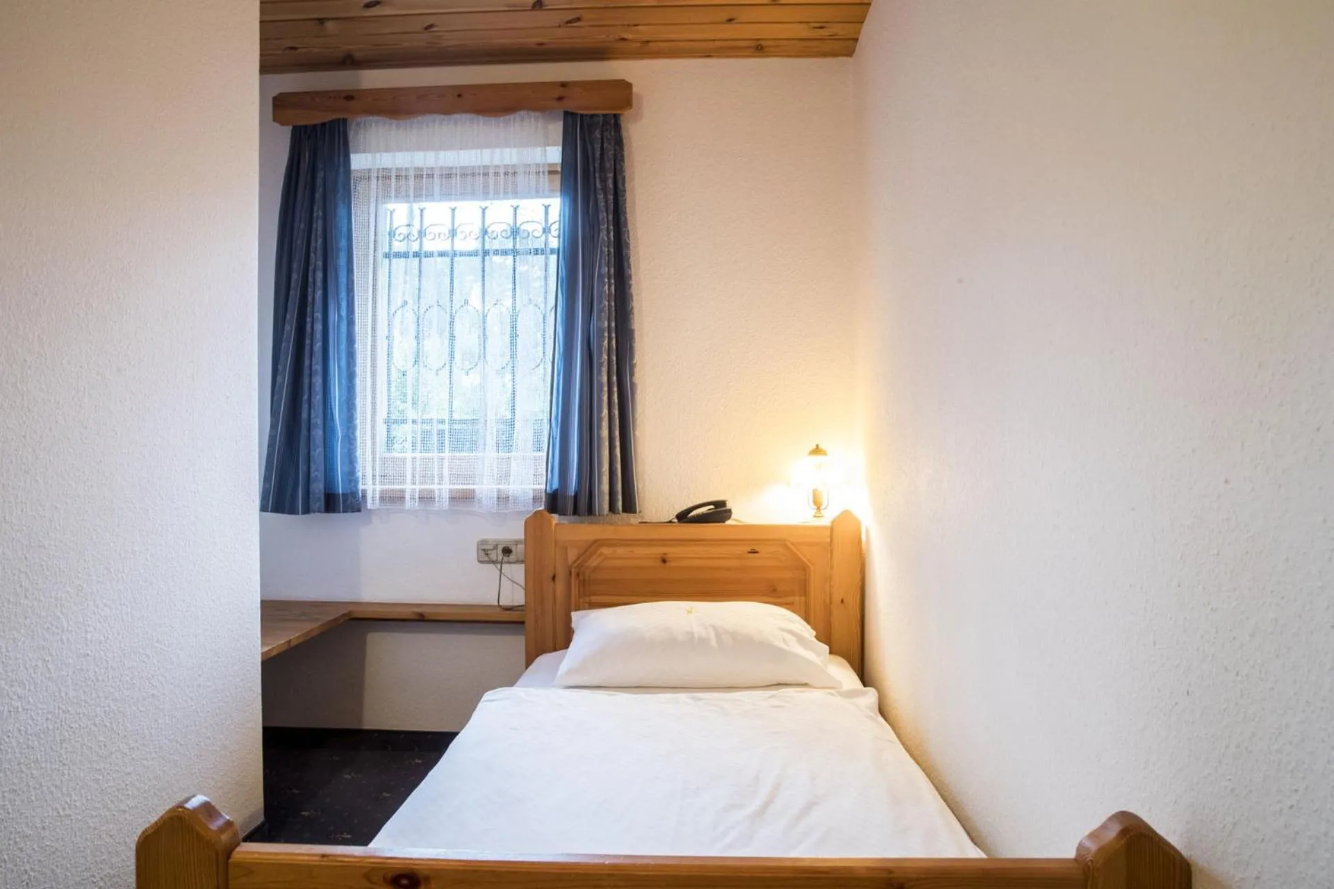 Bed in Garni Hotel Berc