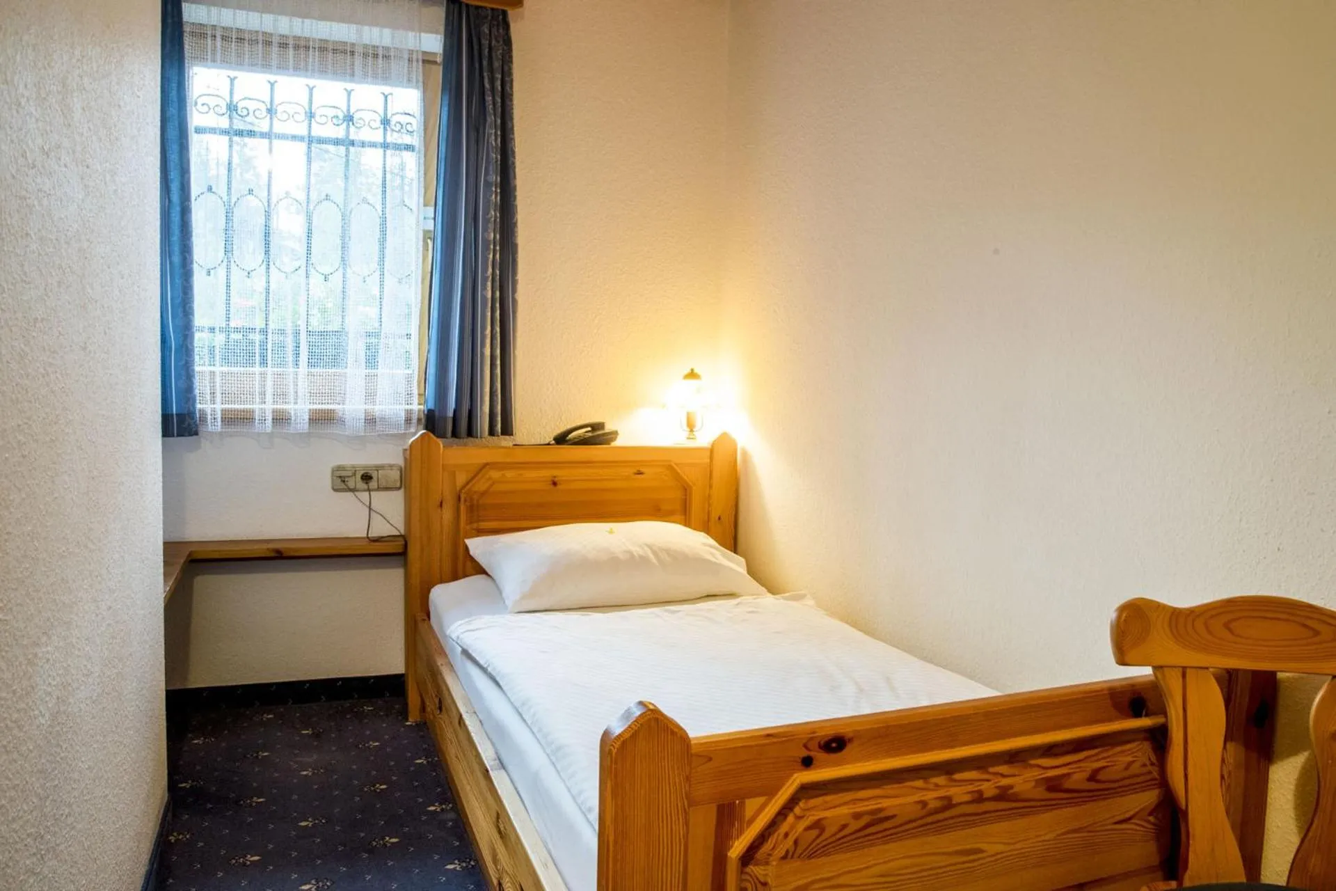 Bed in Garni Hotel Berc