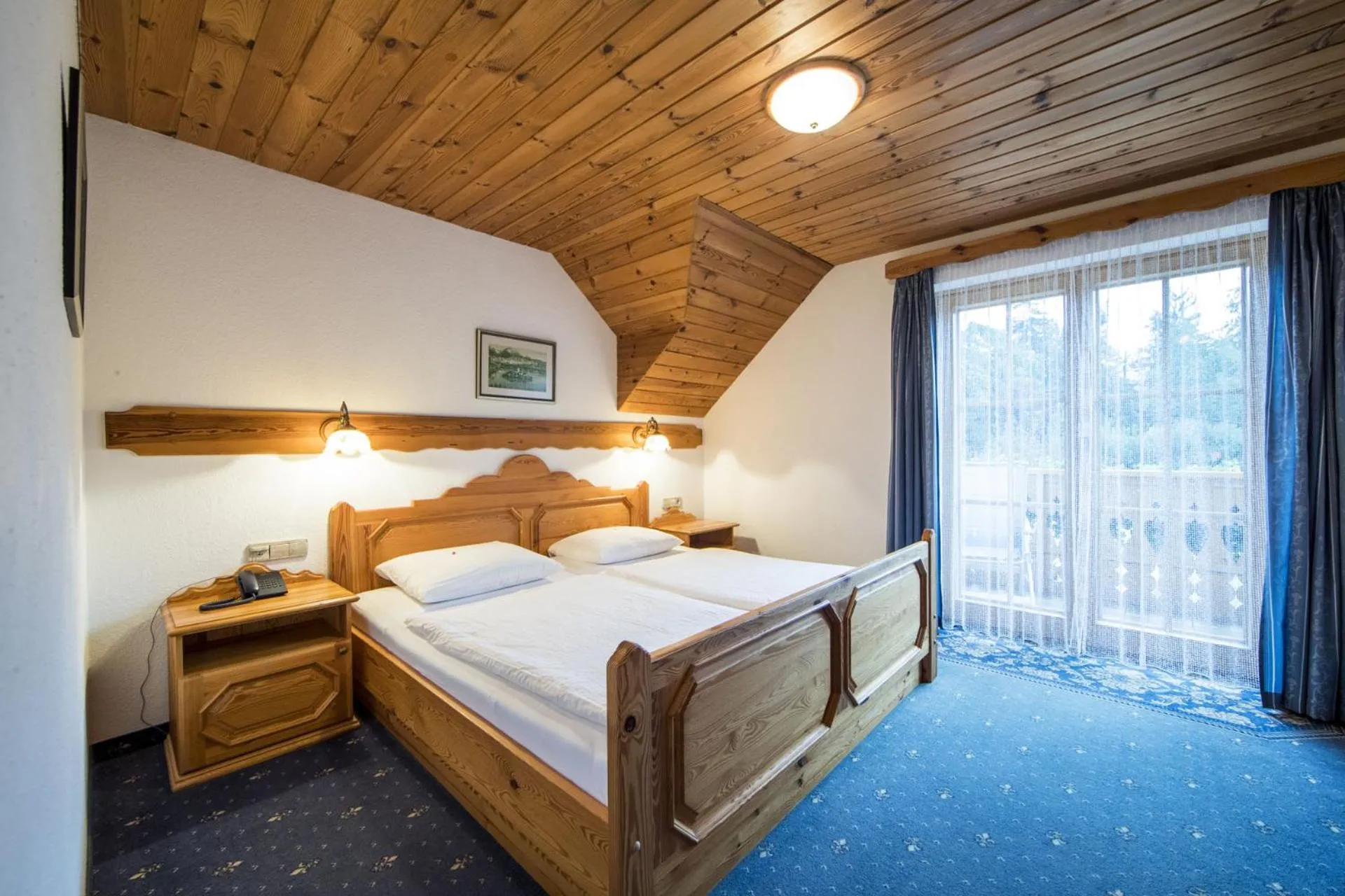 Bed in Garni Hotel Berc