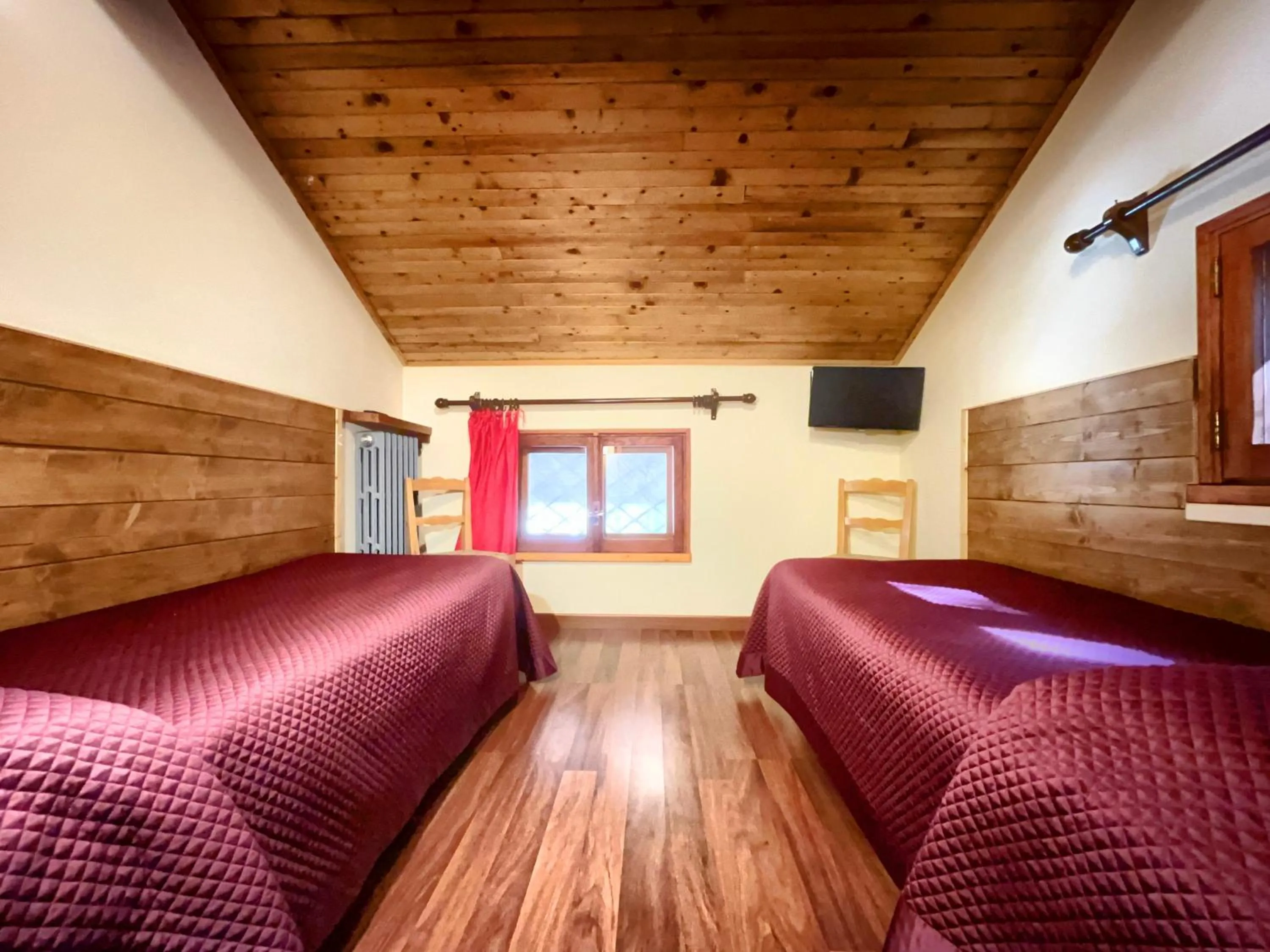 Bed in Hotel Garnì Mille Pini