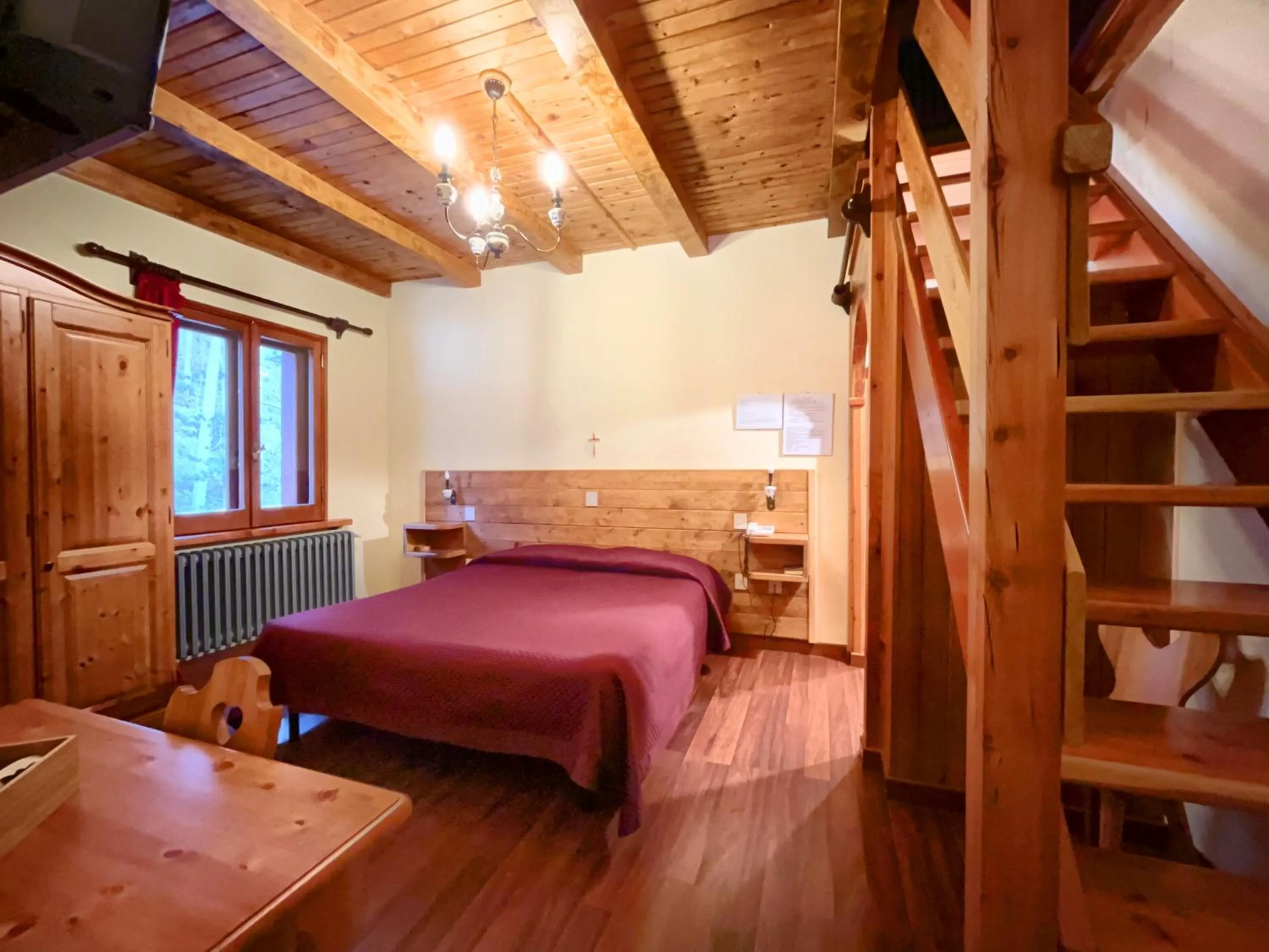 Bed in Hotel Garnì Mille Pini