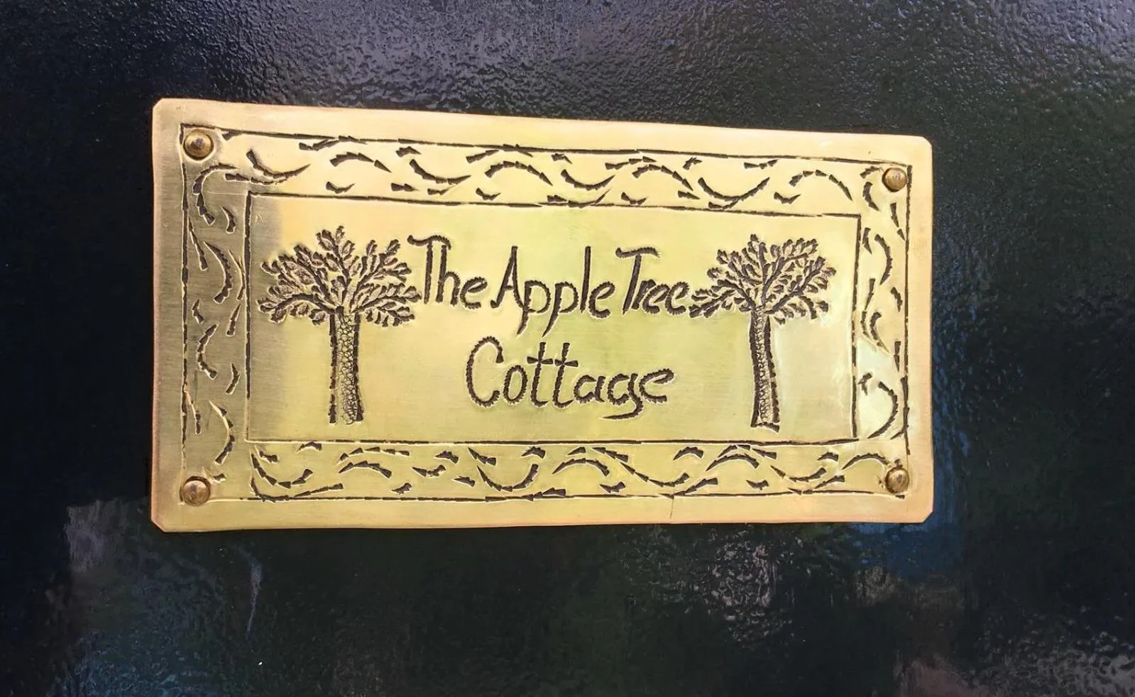 Property logo or sign in Apple Tree Cottage - charming home at beautiful canal in our idyllic garden