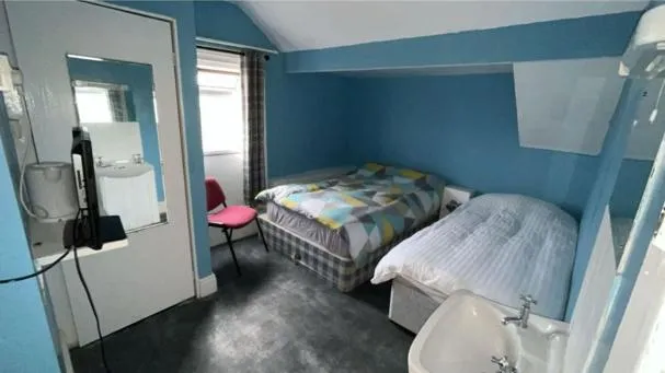 Bed in The Merlin Hotel