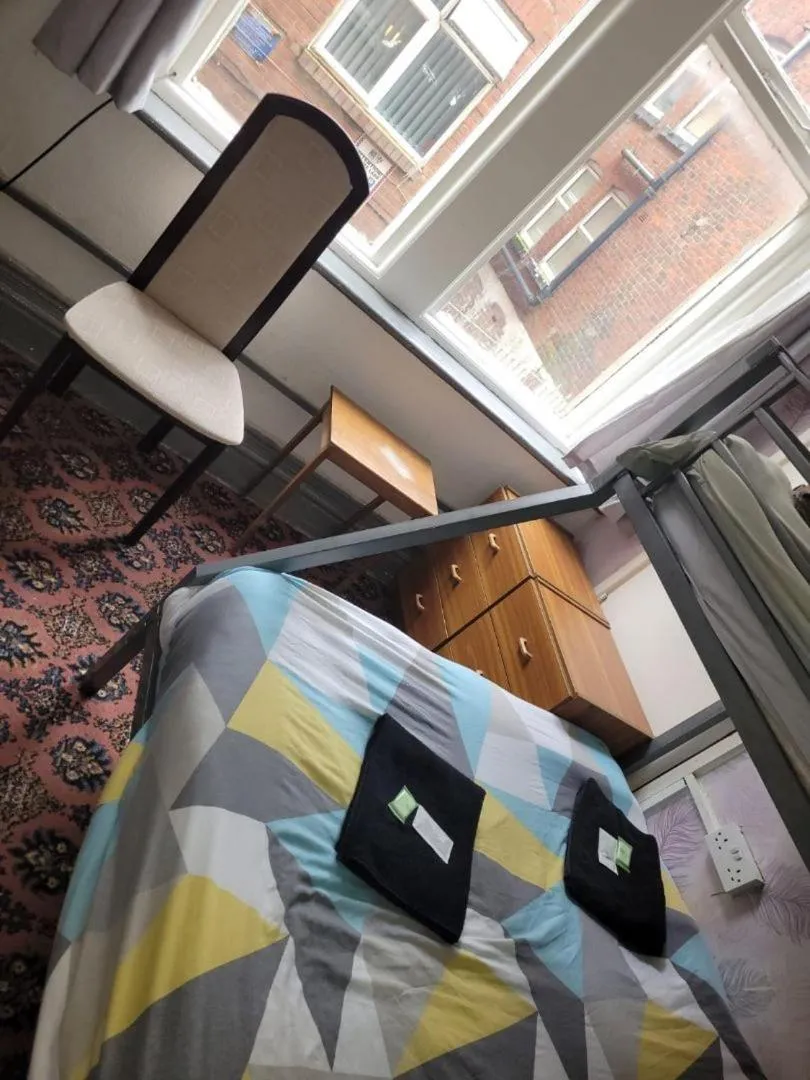 Bed in The Merlin Hotel