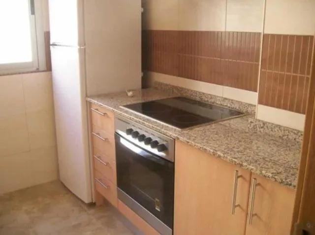 Kitchen or kitchenette in Apartamentos Albamar II