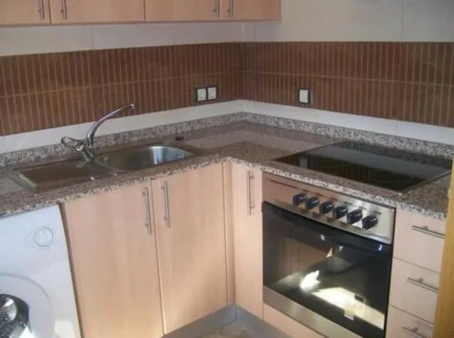 Kitchen or kitchenette in Apartamentos Albamar II