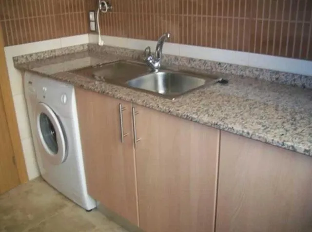 Kitchen or kitchenette in Apartamentos Albamar II