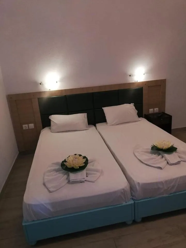 Bed in Gouvia House Luxury Apartments