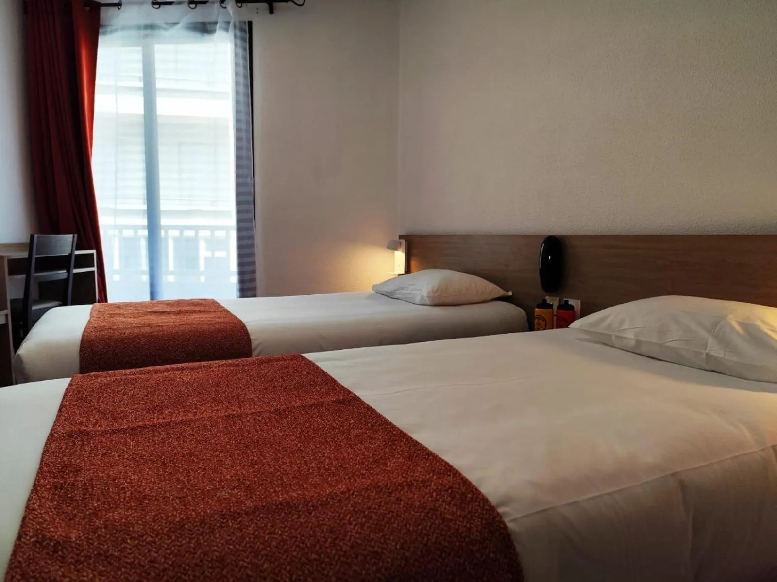 Photo of the whole room, Bed in Hôtel Hélianthe