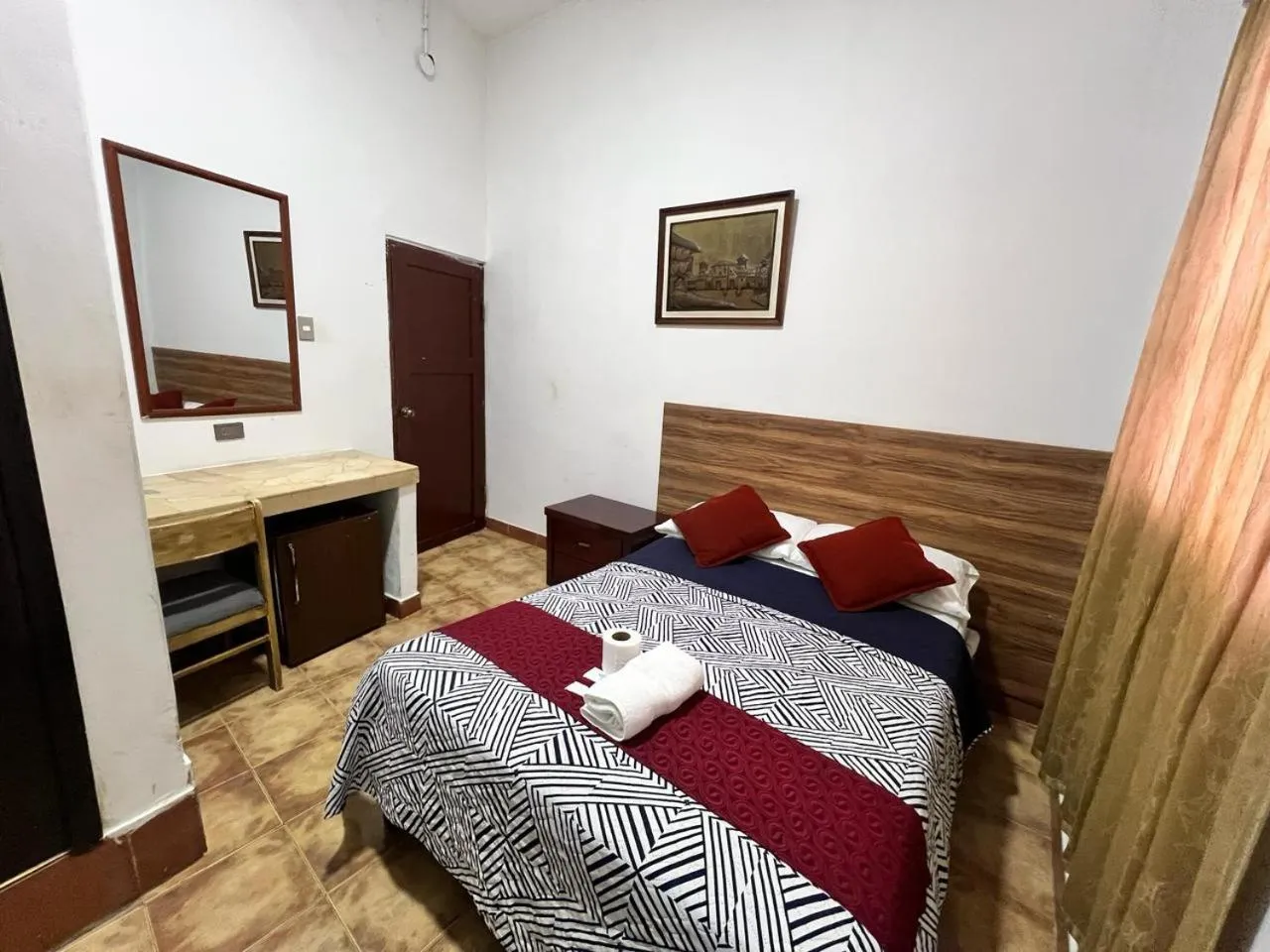 Bed in Atlantic Suites Hotel