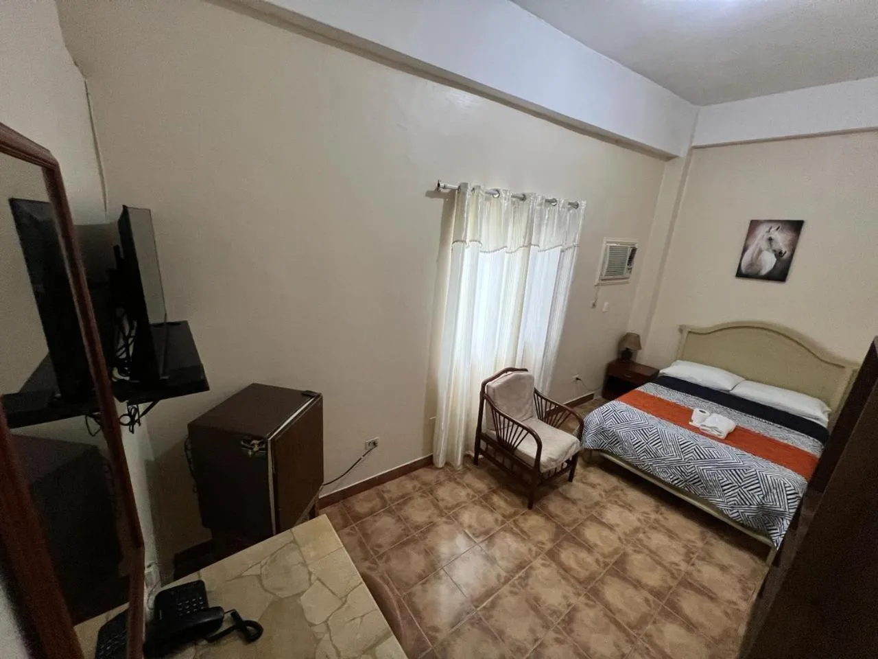 Communal lounge/ TV room, Bed in Atlantic Suites Hotel