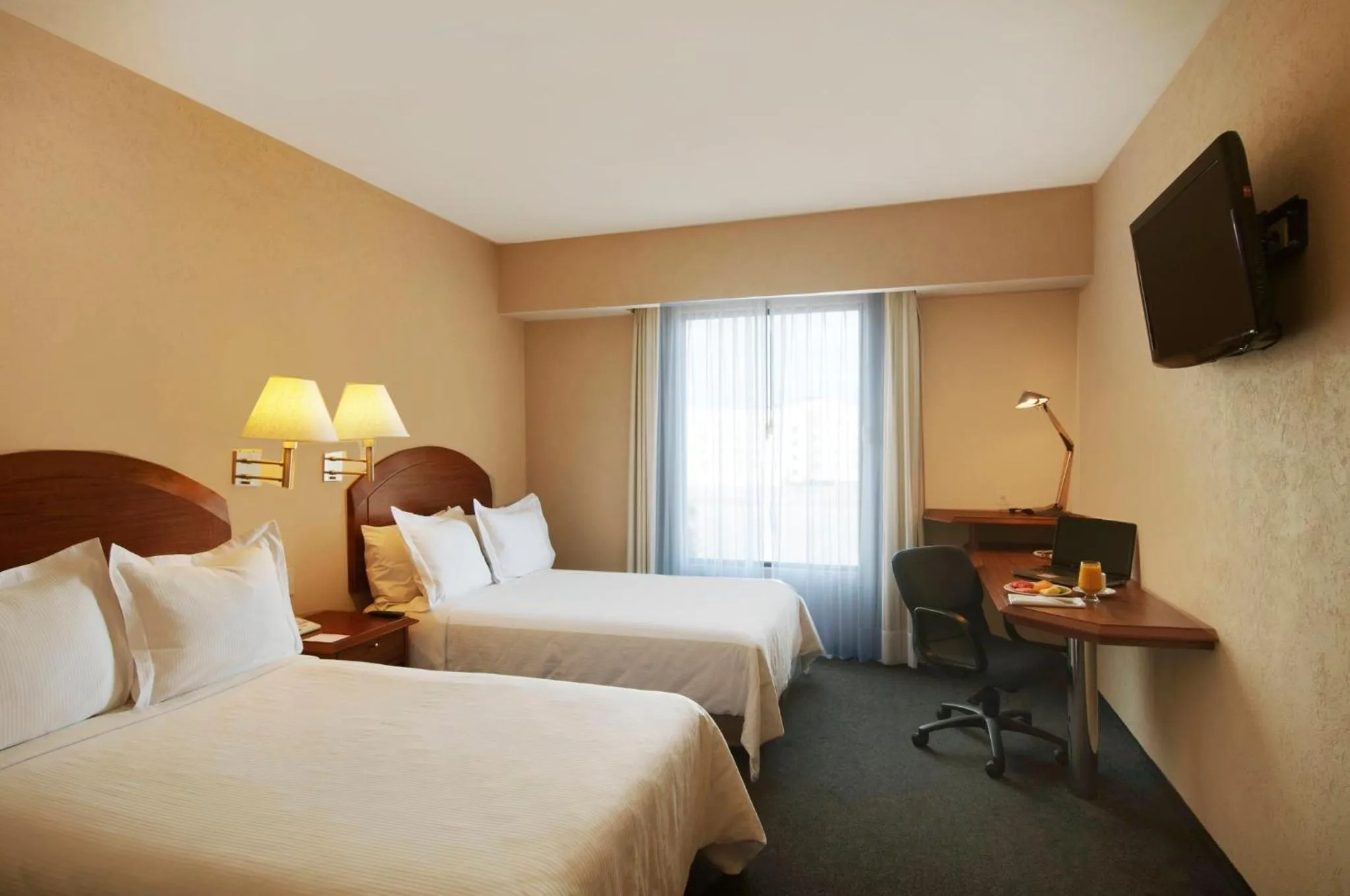 Photo of the whole room, Bed in Fiesta Inn Poza Rica