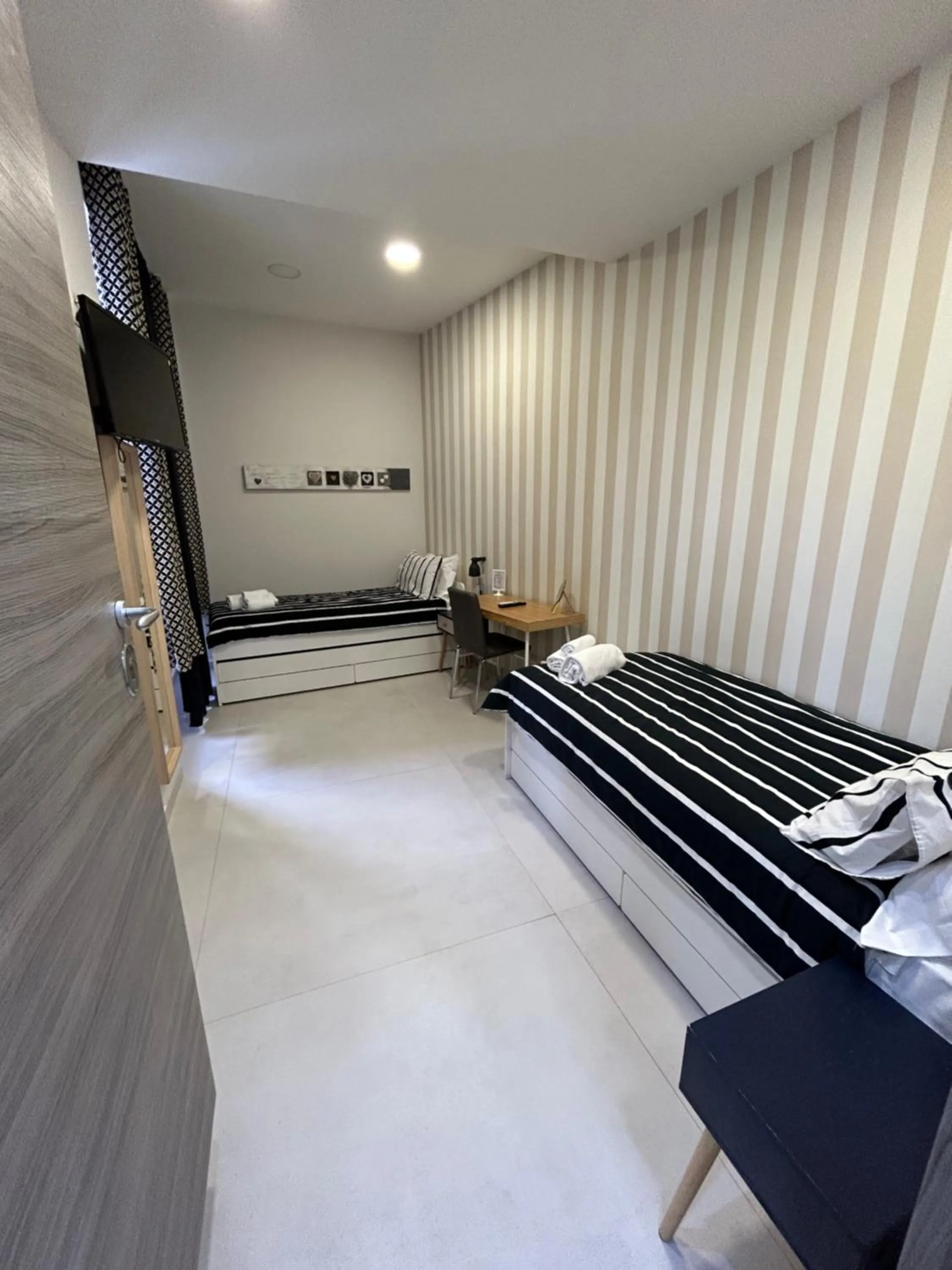 Bed in 2Naples Rooms