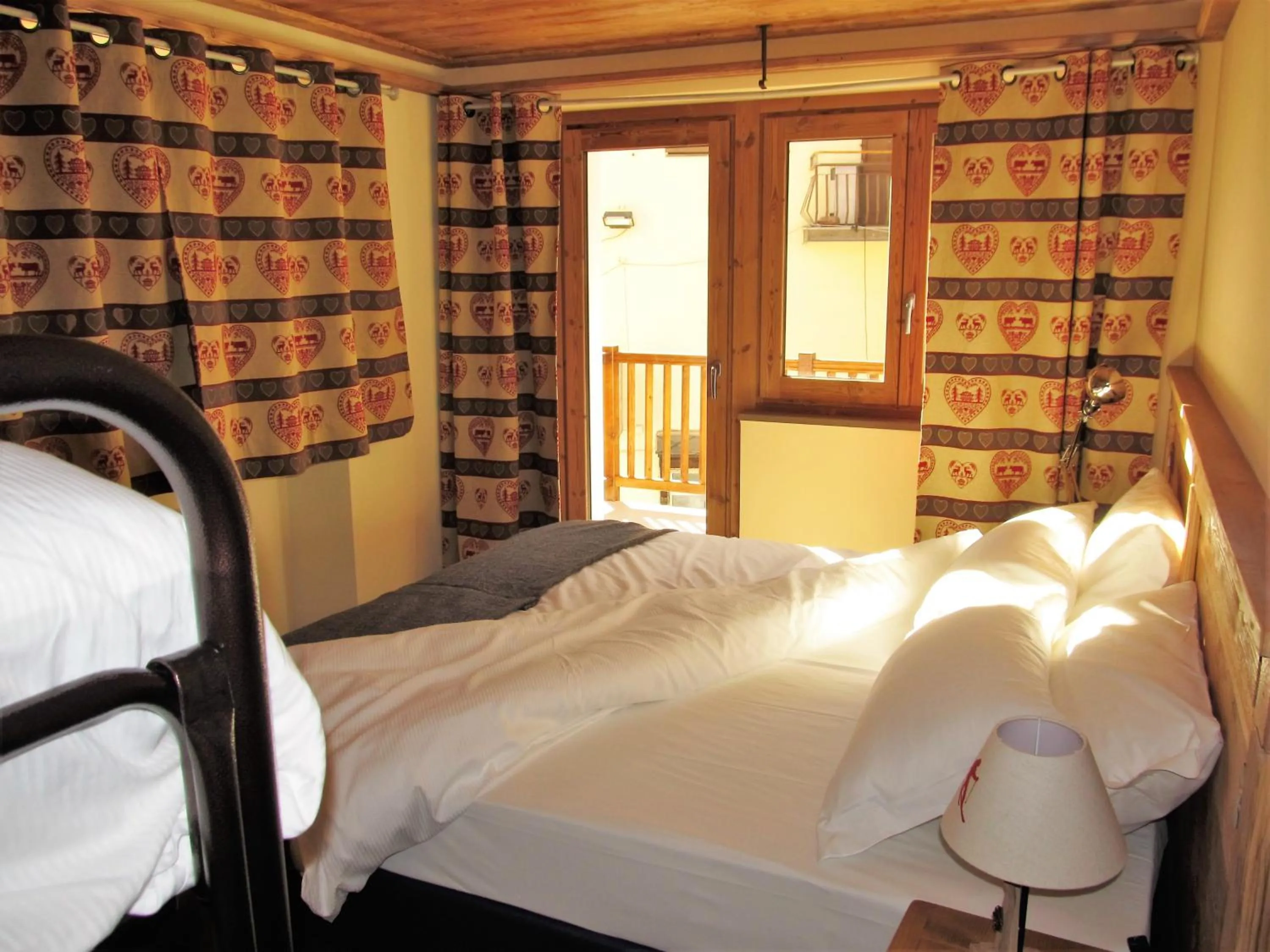 Photo of the whole room, Bed in Miramonti