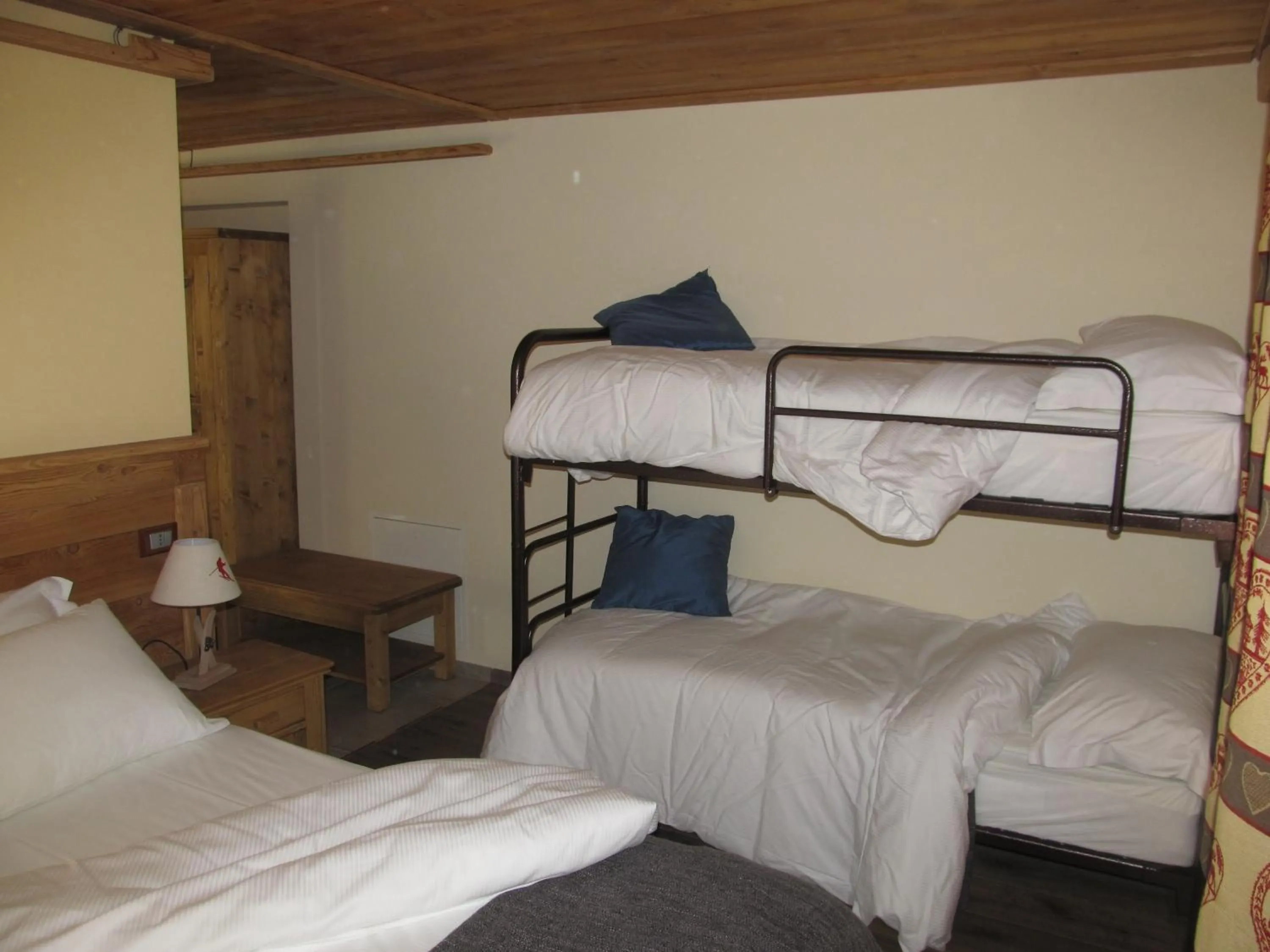 Photo of the whole room, Bed in Miramonti