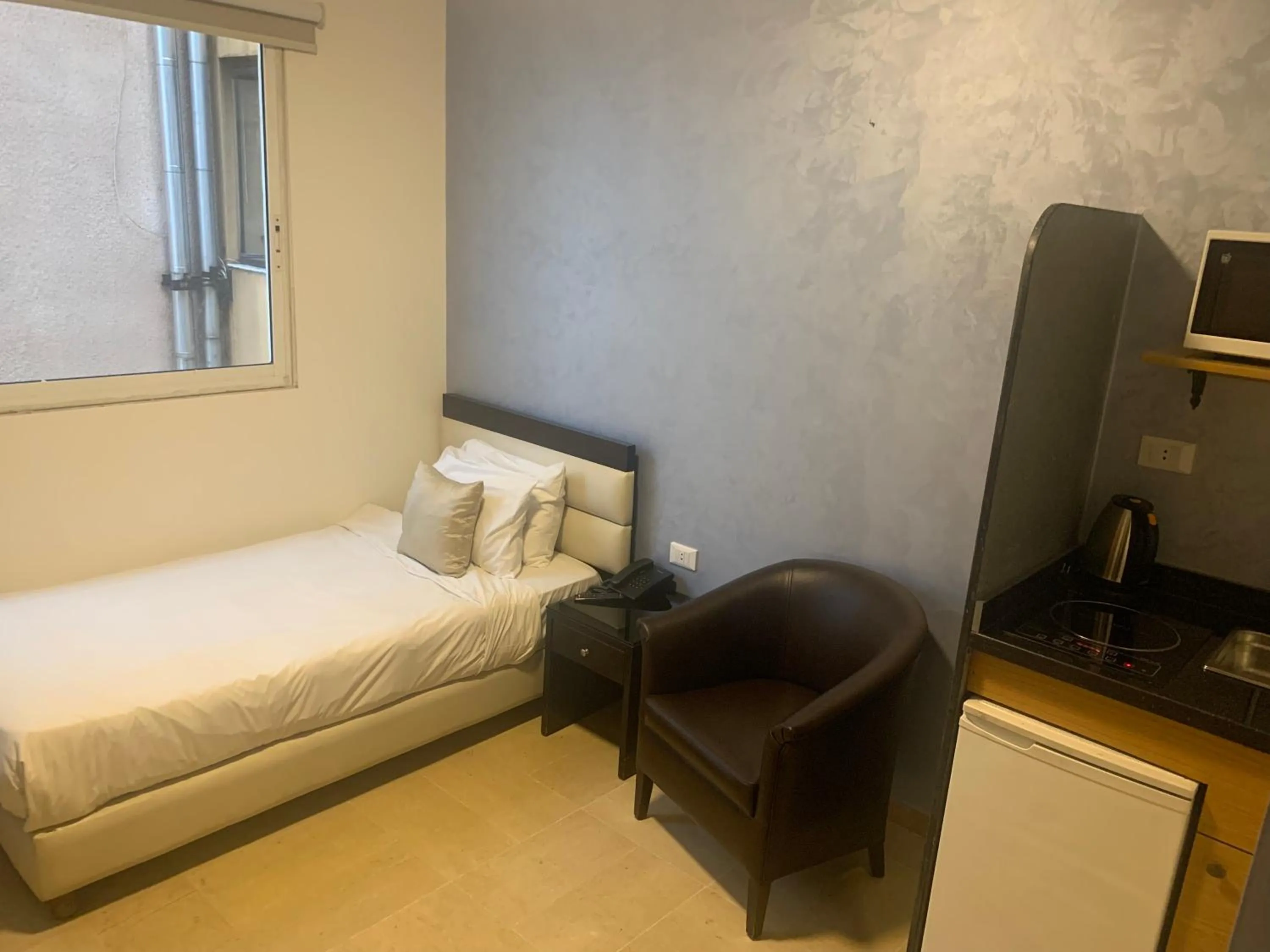 Photo of the whole room, Bed in Bliss 3000 Furnished Studios