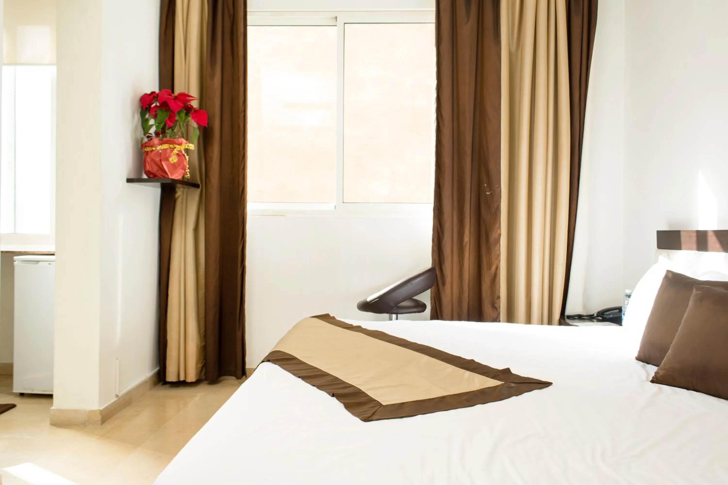 Bedroom, Bed in Bliss 3000 Furnished Studios