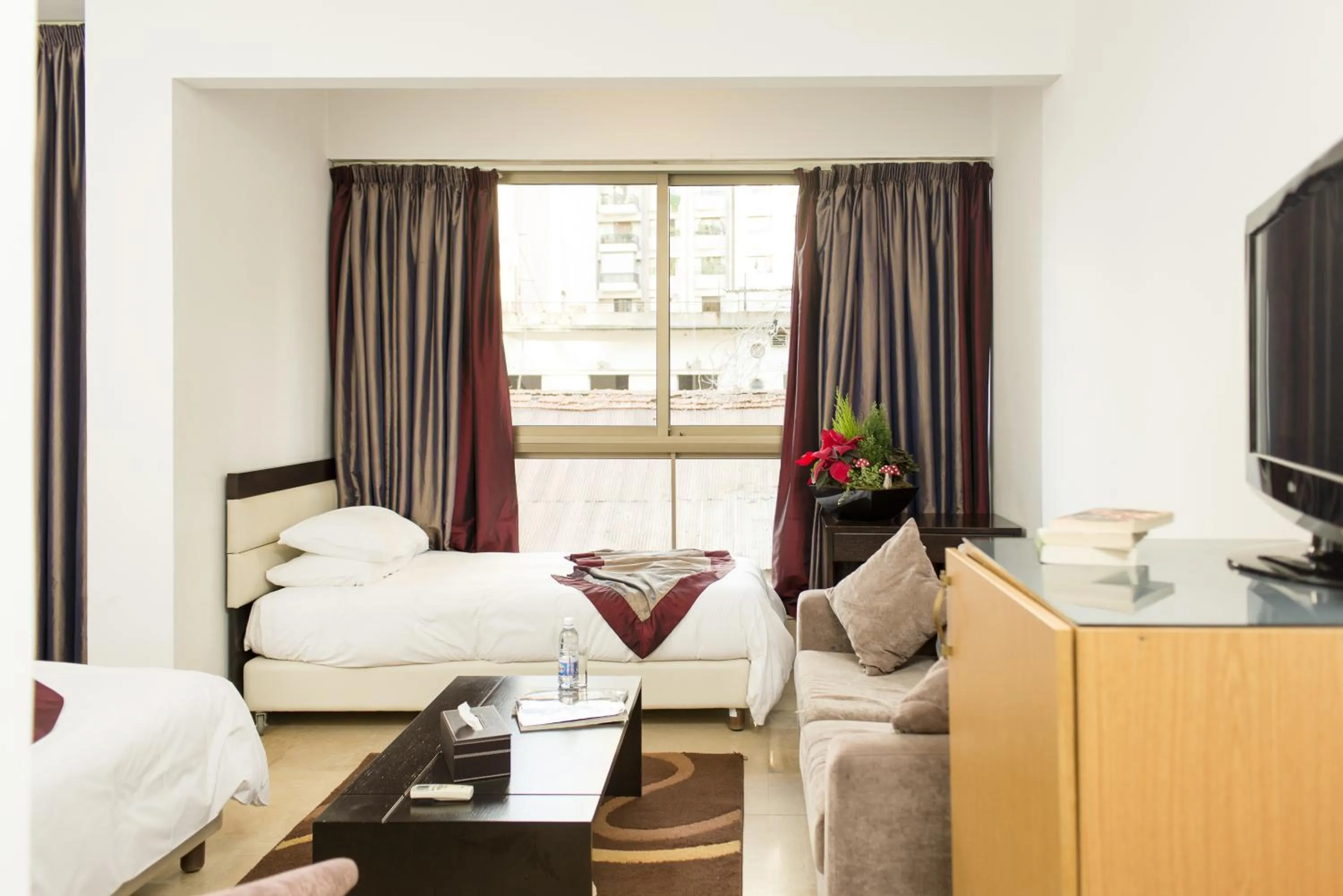 Photo of the whole room, Bed in Bliss 3000 Furnished Studios