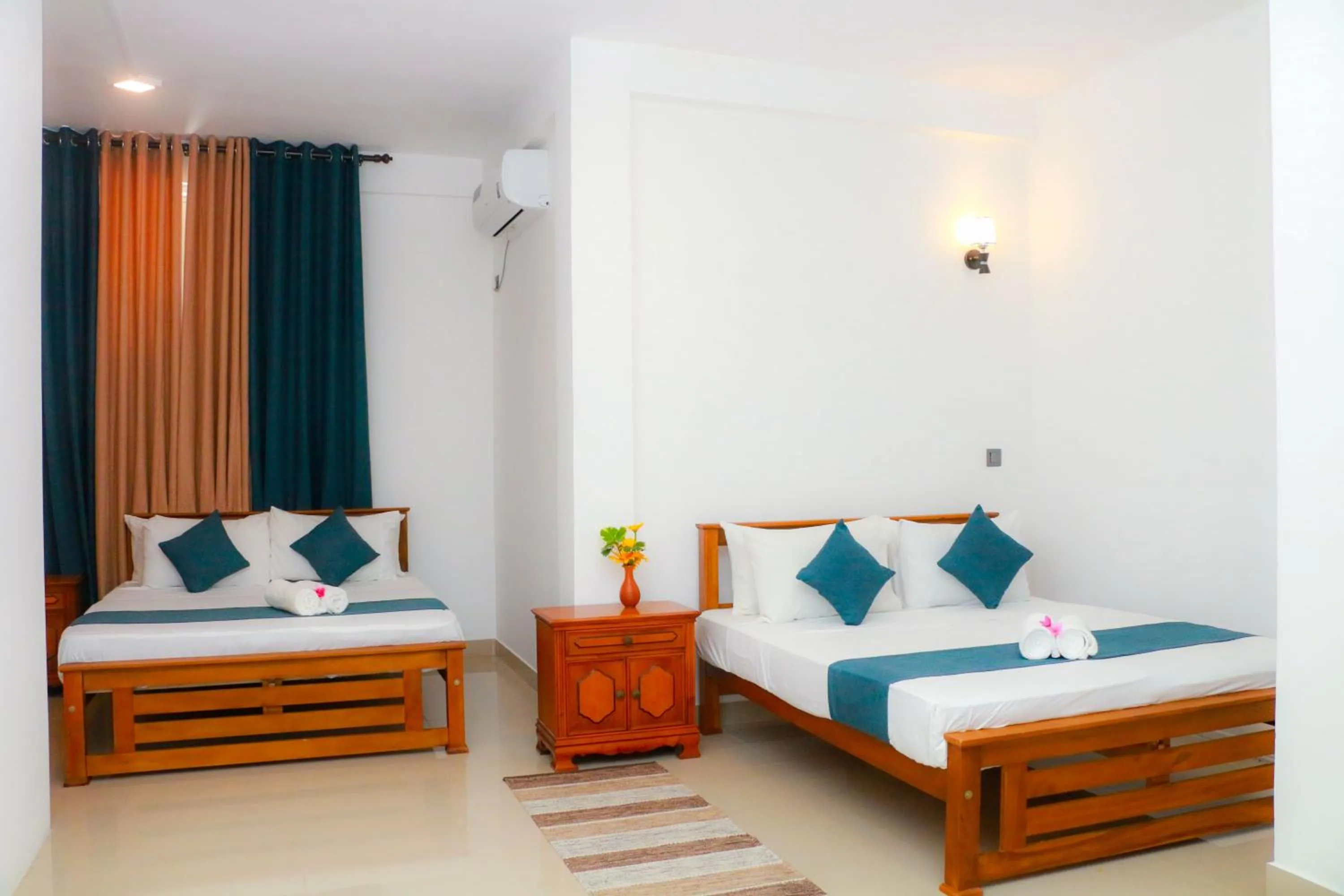 Bed in Queens Beach Hotel