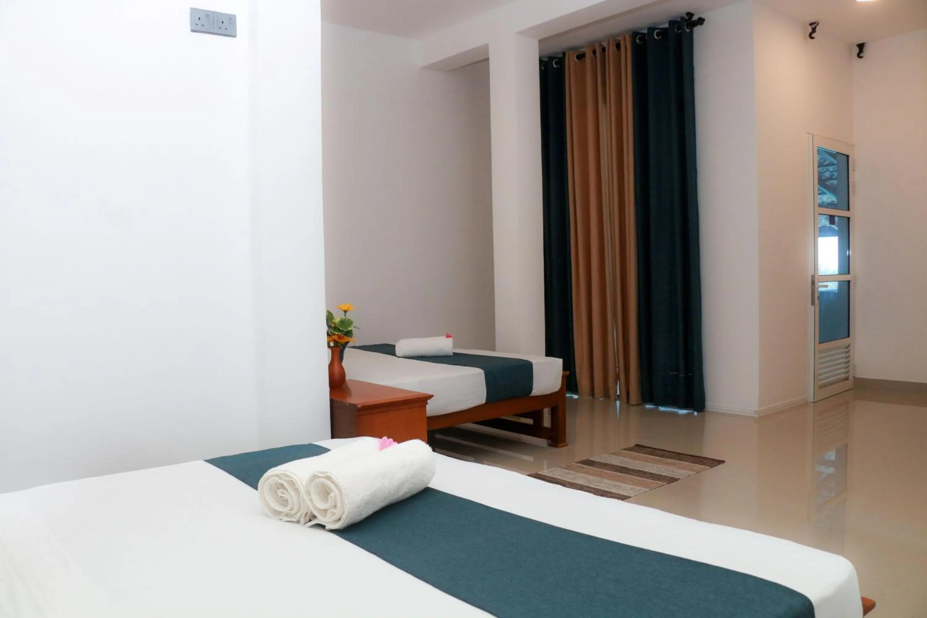 Bed in Queens Beach Hotel