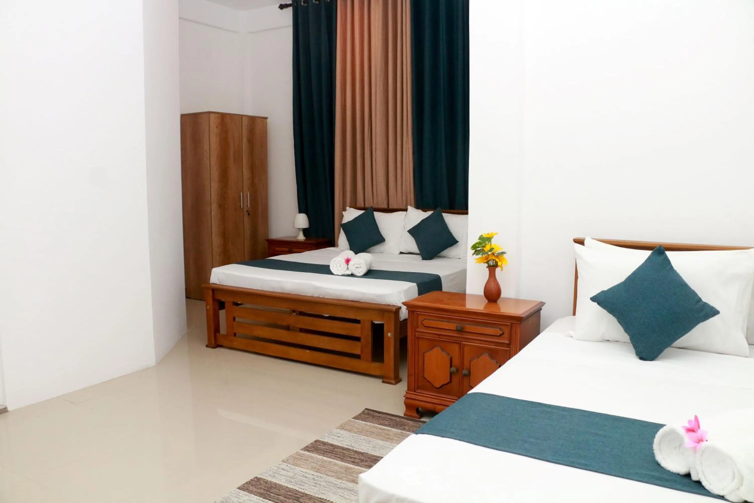 Bed in Queens Beach Hotel