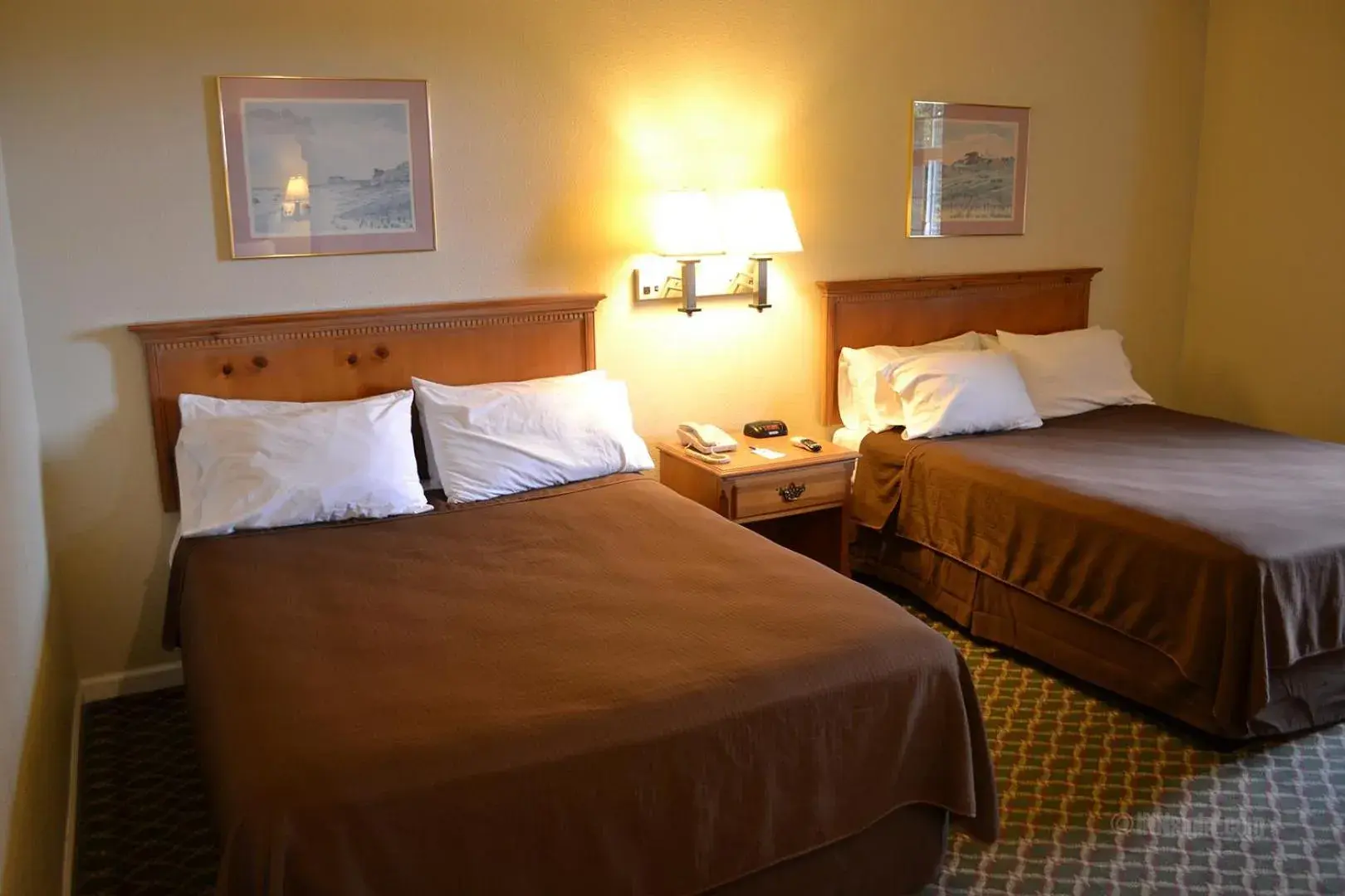 Bed in The Miramar Inn Bed in The Miramar Inn