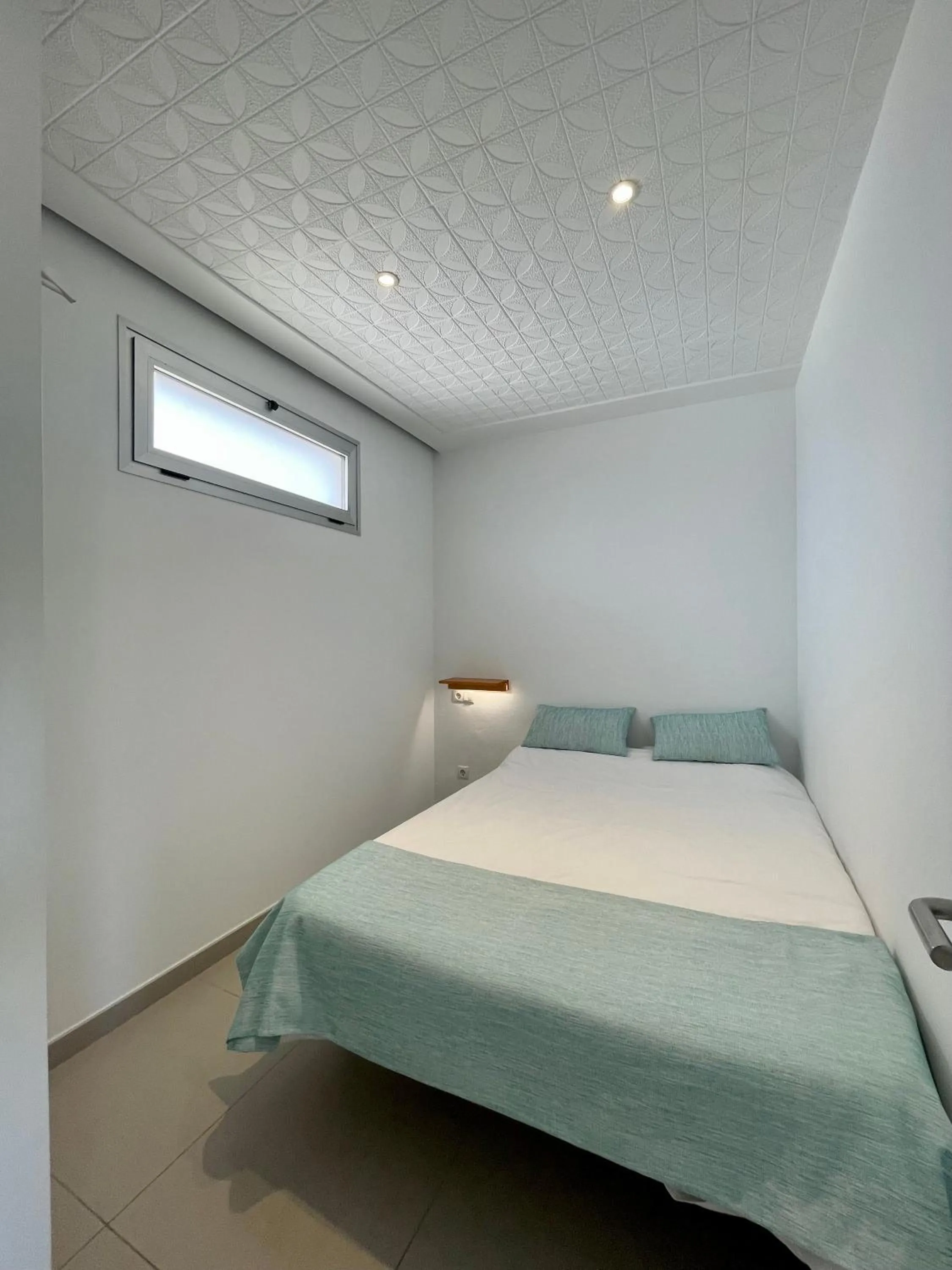 Bed in Apartaments La Perla Negra