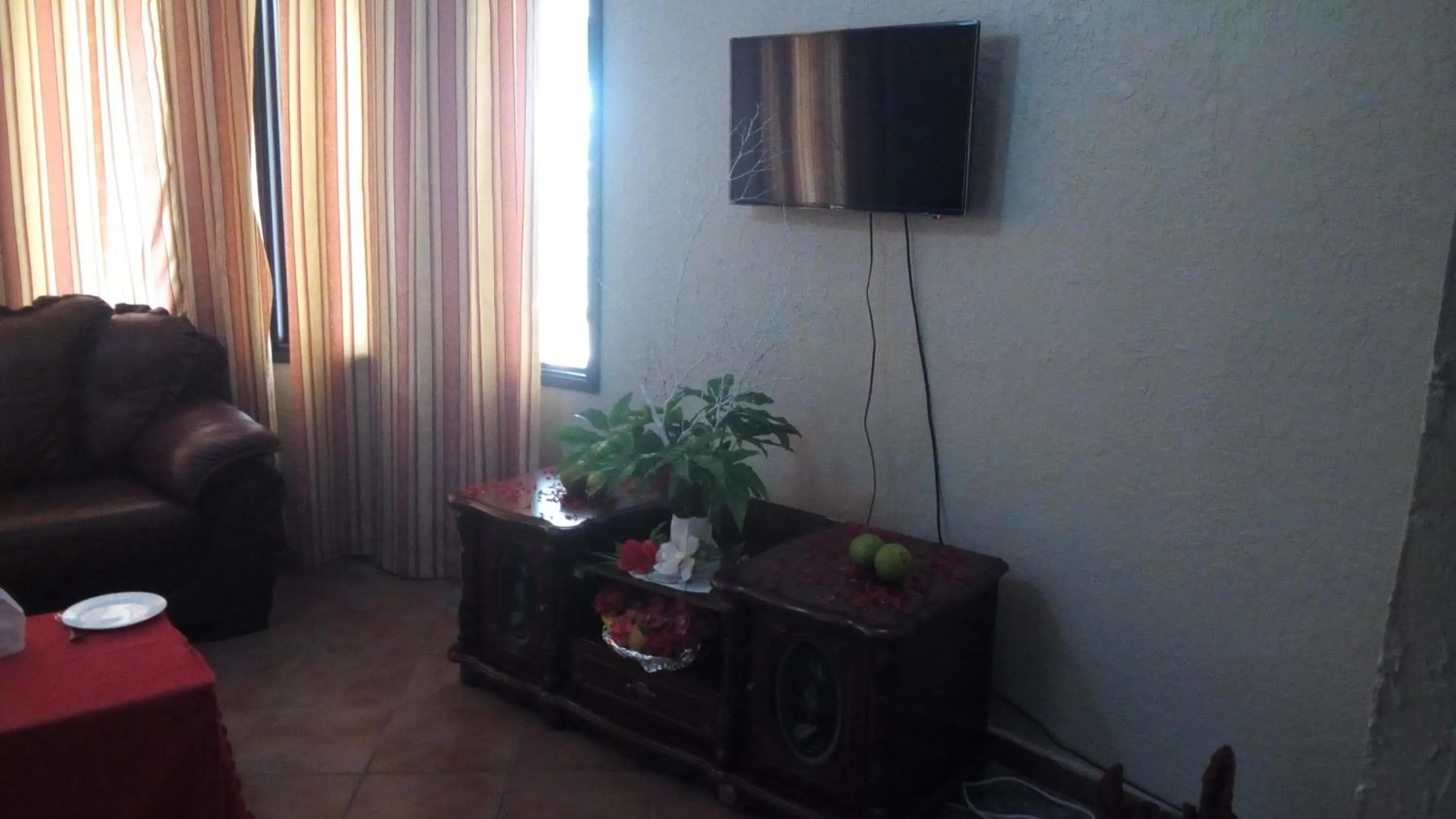 Seating area, TV/Entertainment Center in Serene Hotel