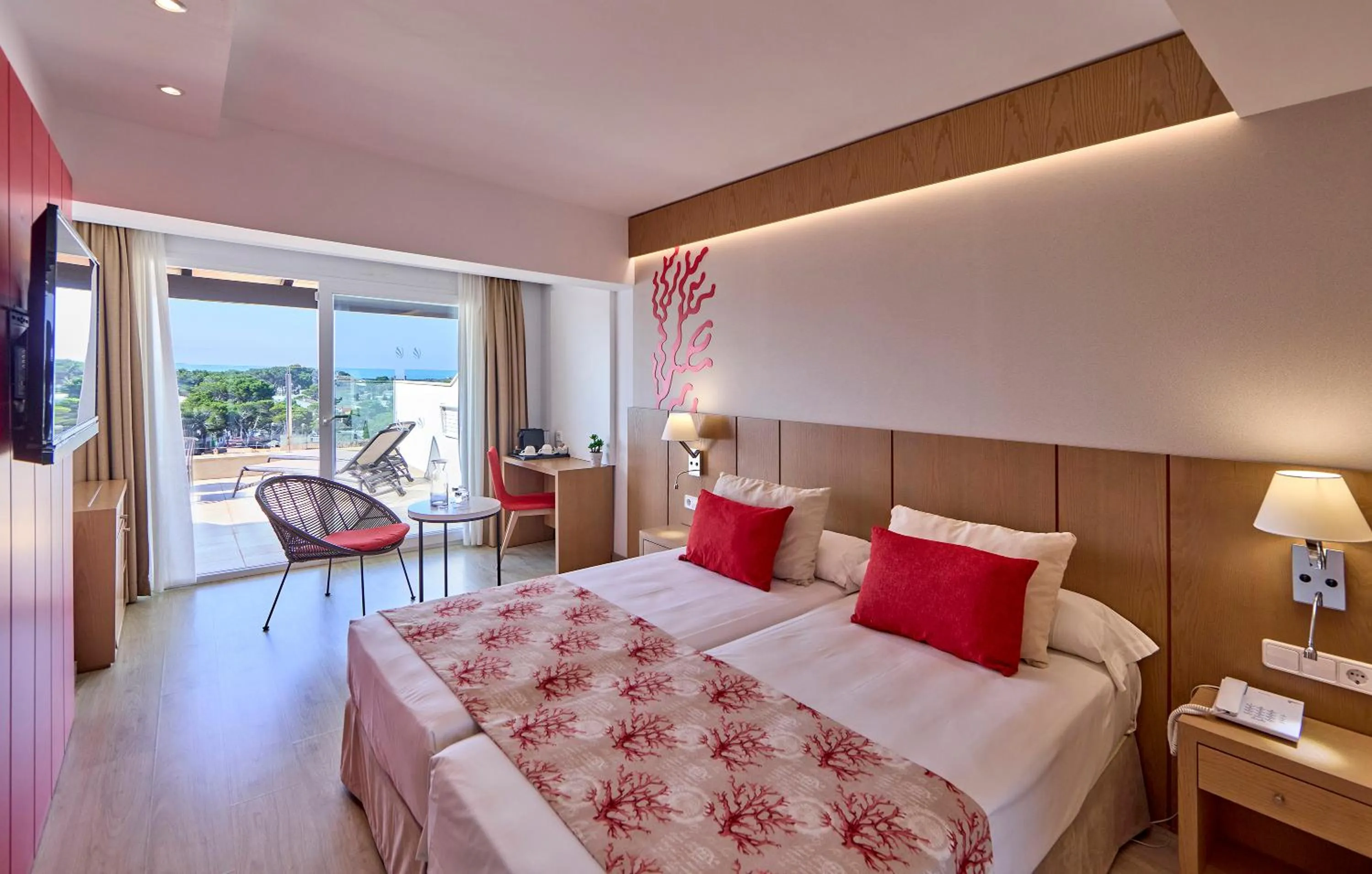 Bed in Universal Hotel Perla